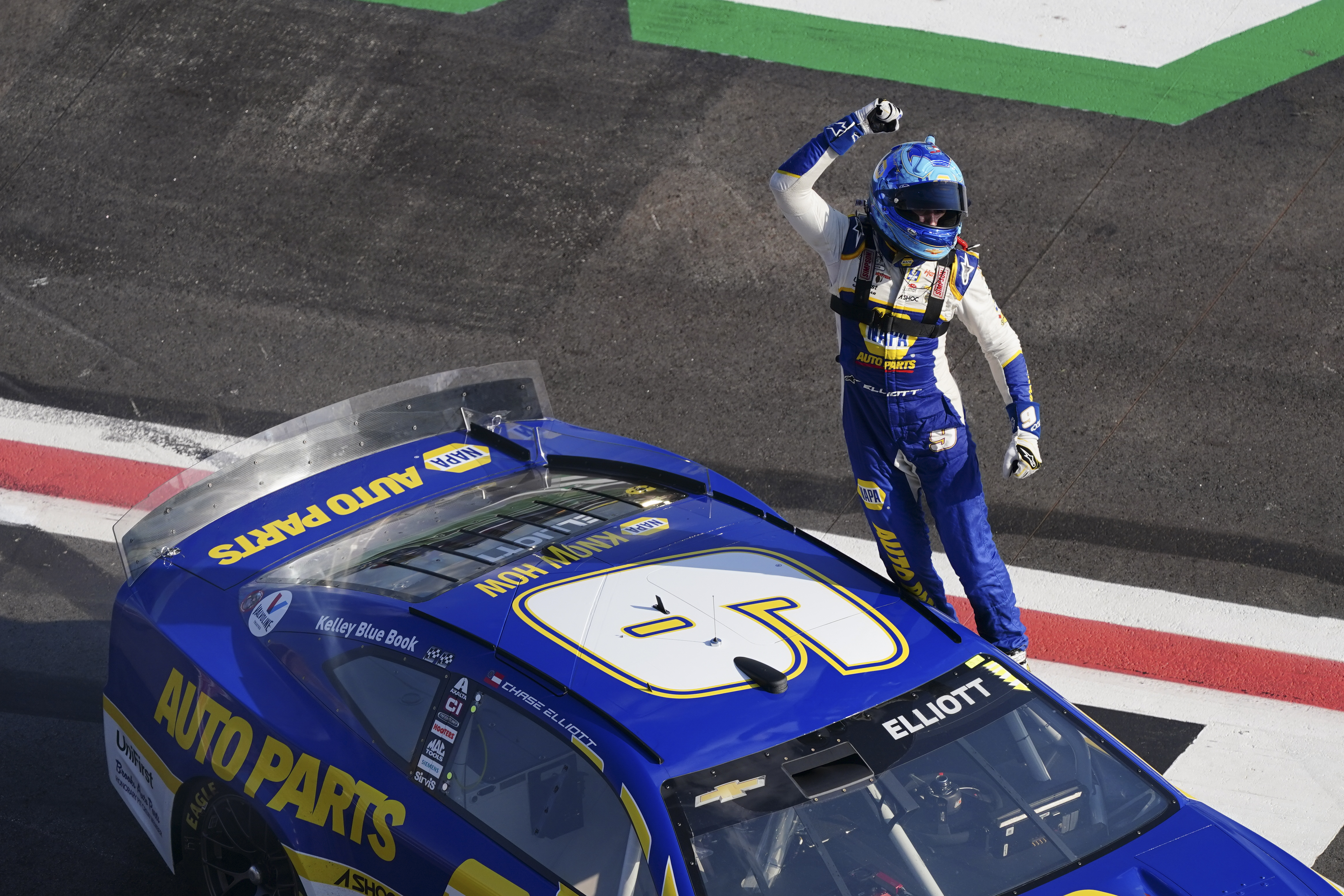 NASCAR Cup Series driver Chase Elliott (9) celebrates after winning a NASCAR Cup Series auto race at Atlanta Motor Speedway, Sunday, July 10, 2022, in Hampton, Ga. 