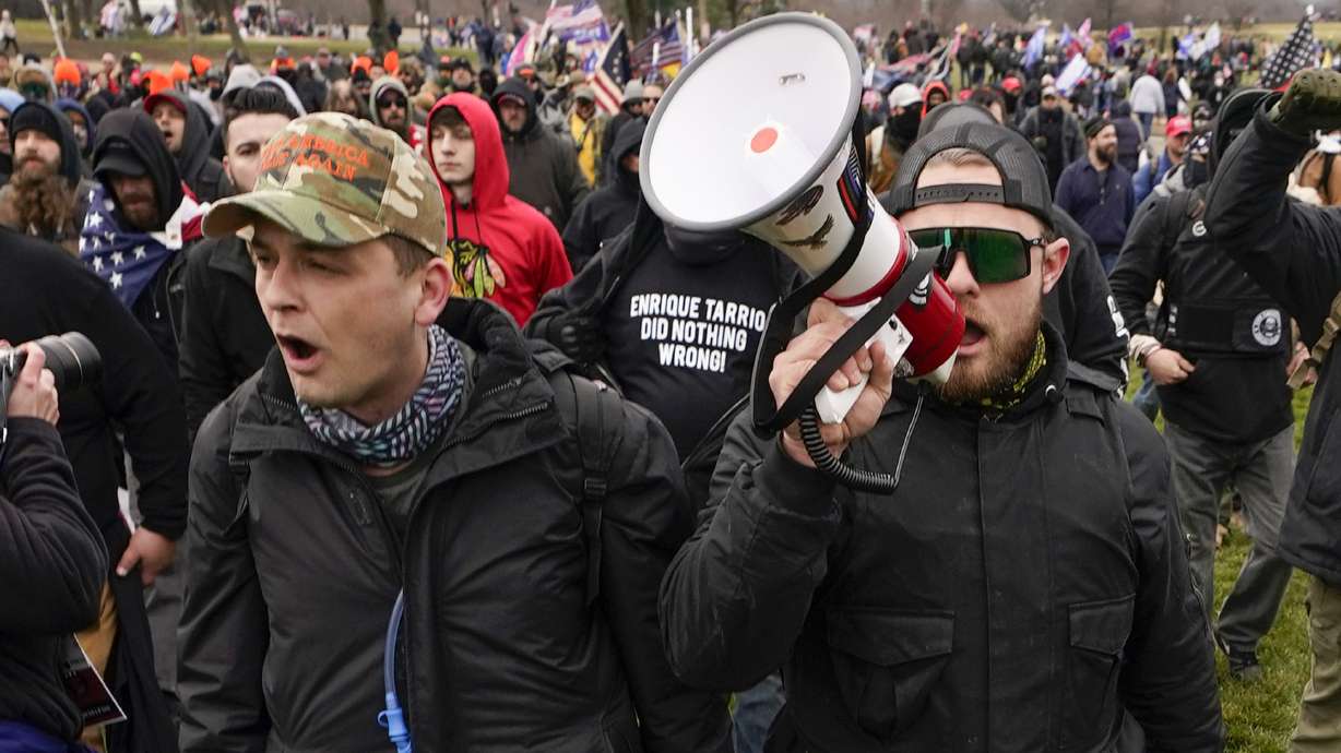 Proud Boys members Zachary Rehl, left, and Ethan Nordean, left, walk toward the U.S. Capitol in Washington, in support of President Donald Trump, Jan. 6, 2021. An upcoming hearing of the U.S. House Committee probing the Jan. 6 insurrection is expected to examine ties between people in former President Donald Trump's orbit and extremist groups who played a role in the Capitol riot.