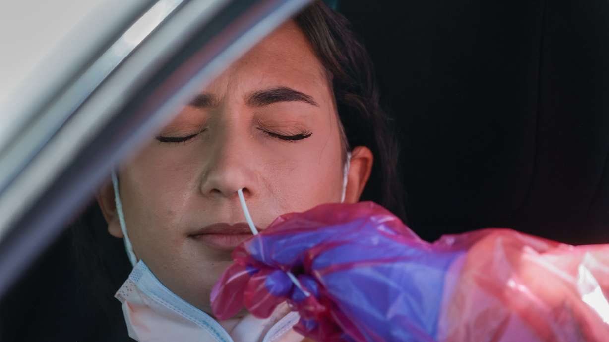 Megan Clay administers a COVID-19 test to Angel Alsammarraie in West Valley City on July 6. While Utah and the rest of the United States are dealing with the newly dominant COVID-19 omicron subvariant known as BA.5, other parts of the world have moved on to a new threat.