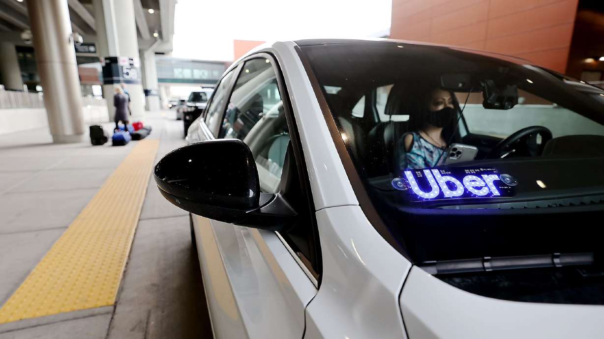 Uber driver Teresea Melendez waits for her passenger at the Salt Lake City Airport on Feb. 1, 2021. Confidential documents leaked to a news organization claim to show how the rideshare company “flouted laws, duped police, exploited violence against drivers and secretly lobbied governments during its aggressive global expansion.”