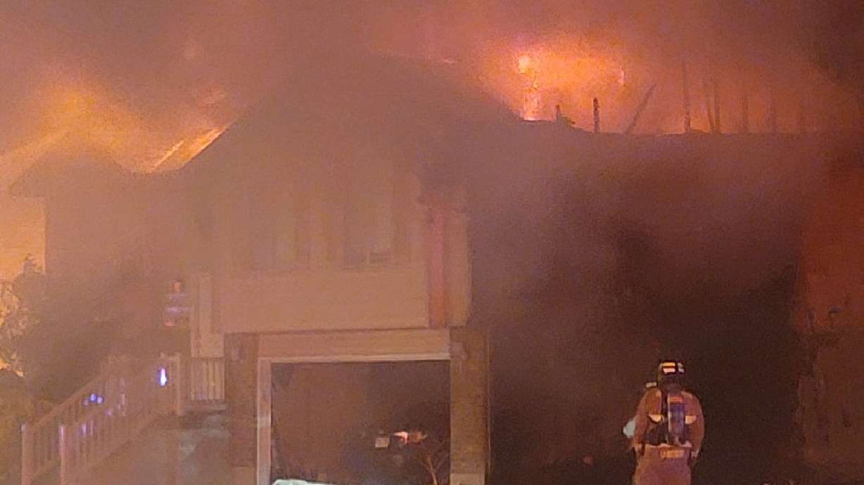 A Clinton home is a total loss after coals the residents thought were cold started a fire on the side of the house.