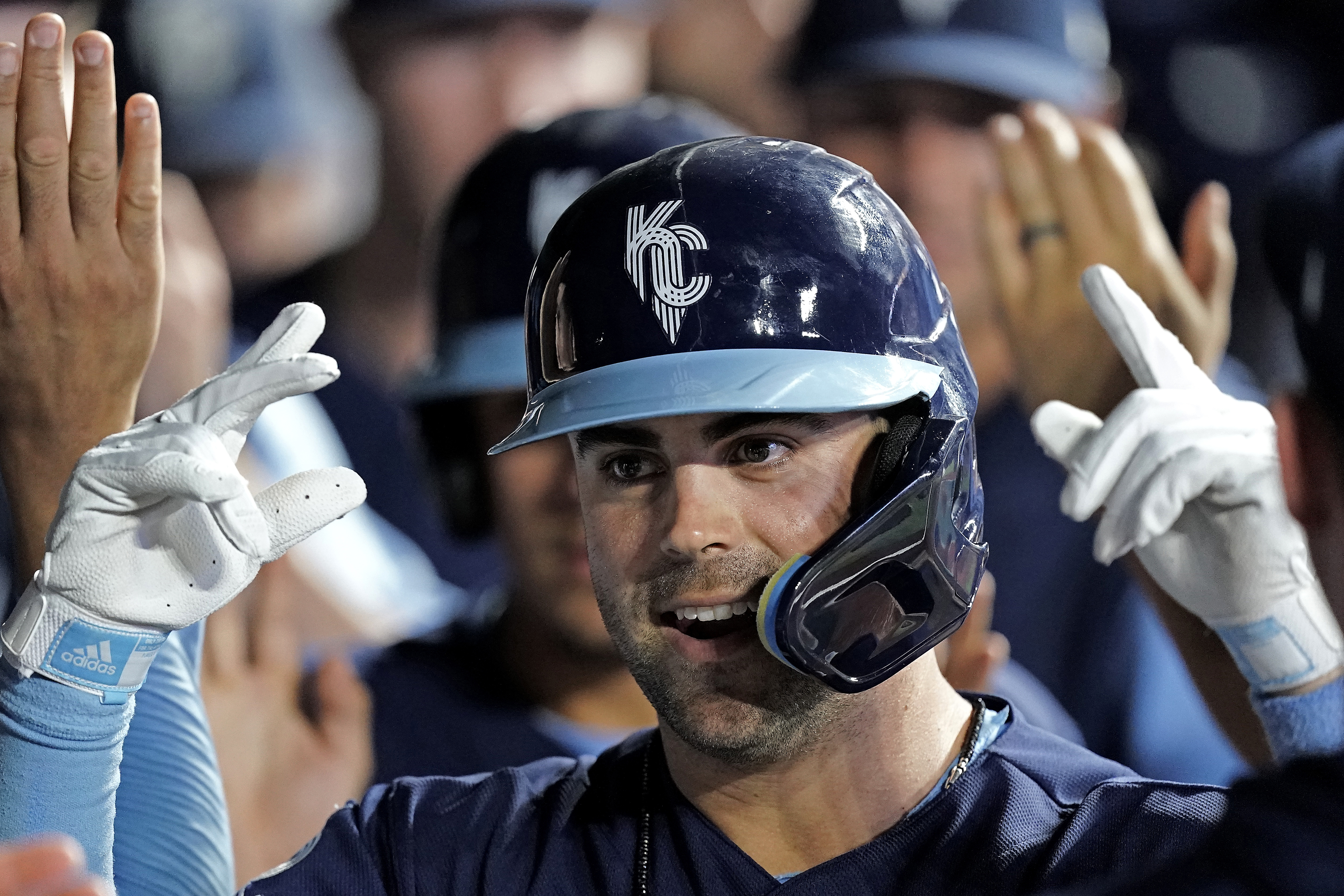 Kansas City Royals' Whit Merrifield celebrates in the dugout after hitting a two-run home run during the eighth inning of a baseball game against the Cleveland Guardians Friday, July 8, 2022, in Kansas City, Mo. 
