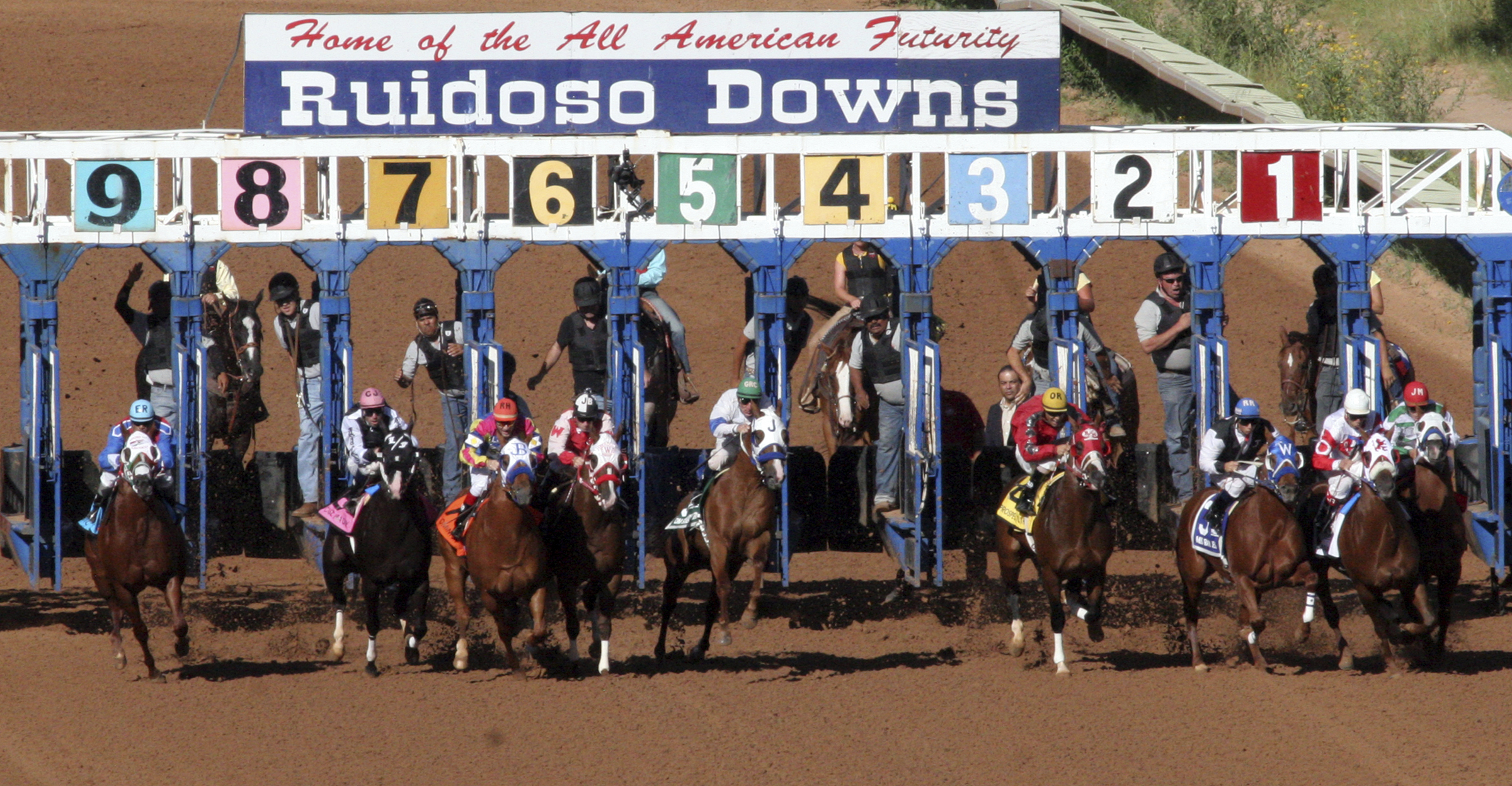 FILE - Horses leave the starting gate at Ruidoso Downs Racetrack and Casino in Ruidoso, N.M., on Sept. 6, 2010. New Mexico regulators on Monday, July 11, 2022, said several horses that were feared dead by animal advocates following a weekend of racing at one of the state's premiere horse tracks are alive and well. Officials with the New Mexico Racing Commission said only one animal died after being injured during recent trials at Ruidoso Downs and that photographs and veterinary reports submitted to the state show the other seven were in their stalls and were fine. 