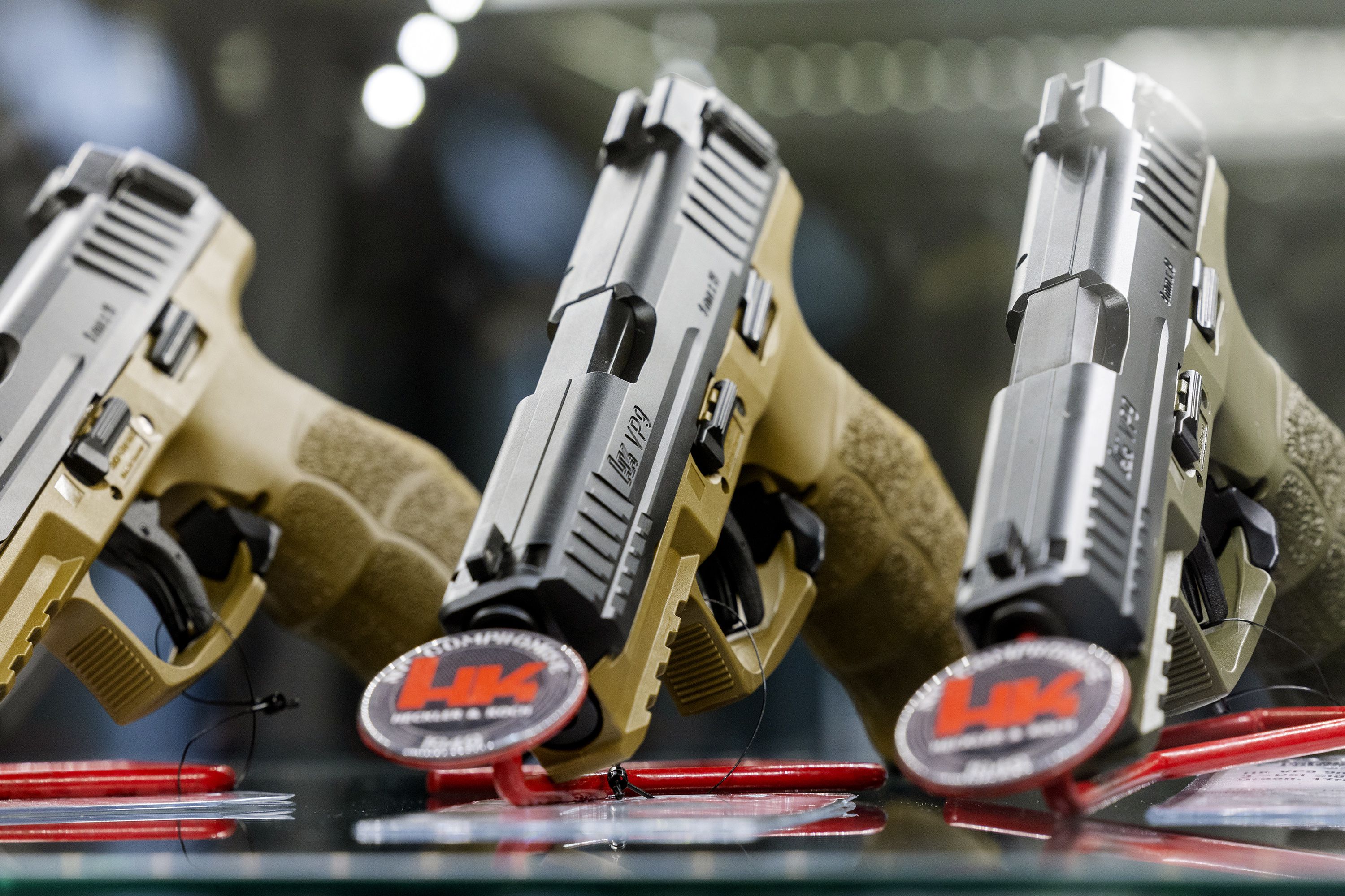 Heckler and Koch pistols are displayed at Impact Guns in South Salt Lake on July 6. Just over half of Utahns say they have a gun in their home, according to a new poll.