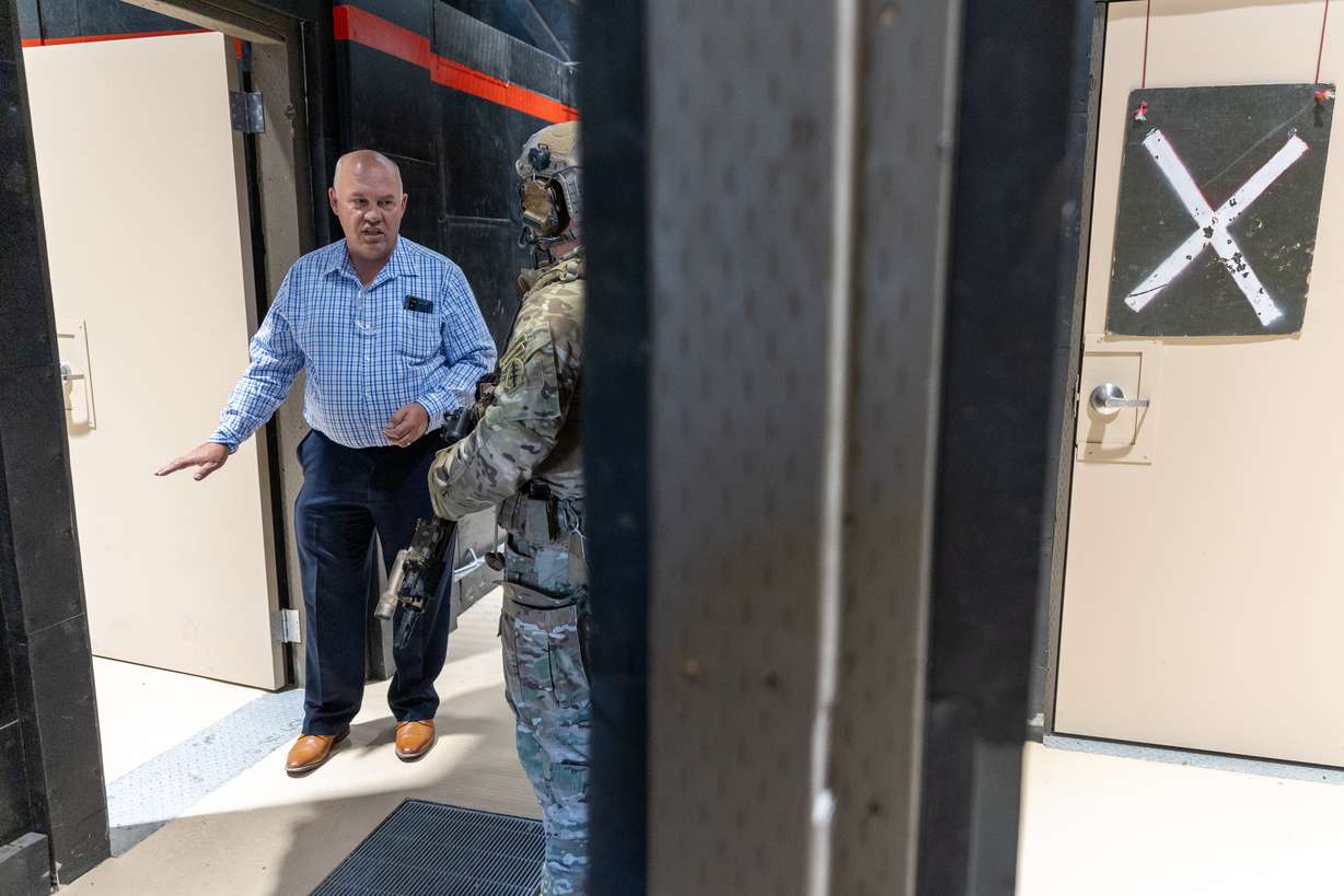 Utah County Commissioner Bill Lee speaks to a soldier from the Utah National Guard's 19th Special Forces Group (Airborne) inside a new Special Operations Forces Live-Fire Shoot House at Camp Williams on Monday.