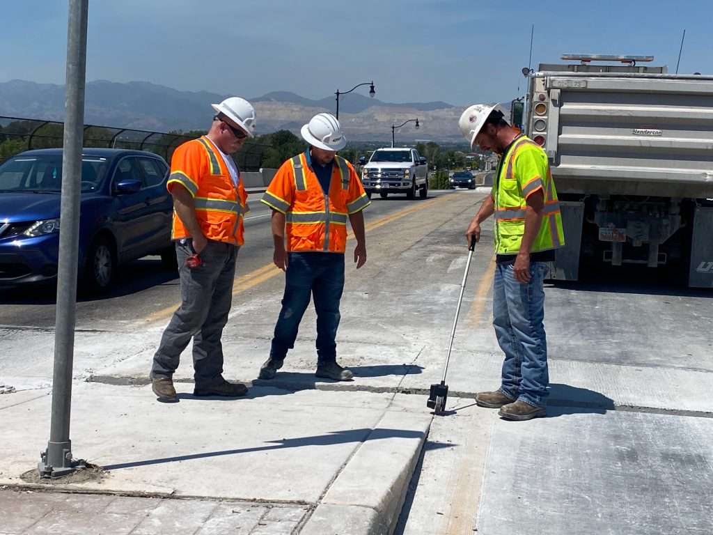 UDOT crews work Monday on concrete pavement that buckled in the heat in Draper.