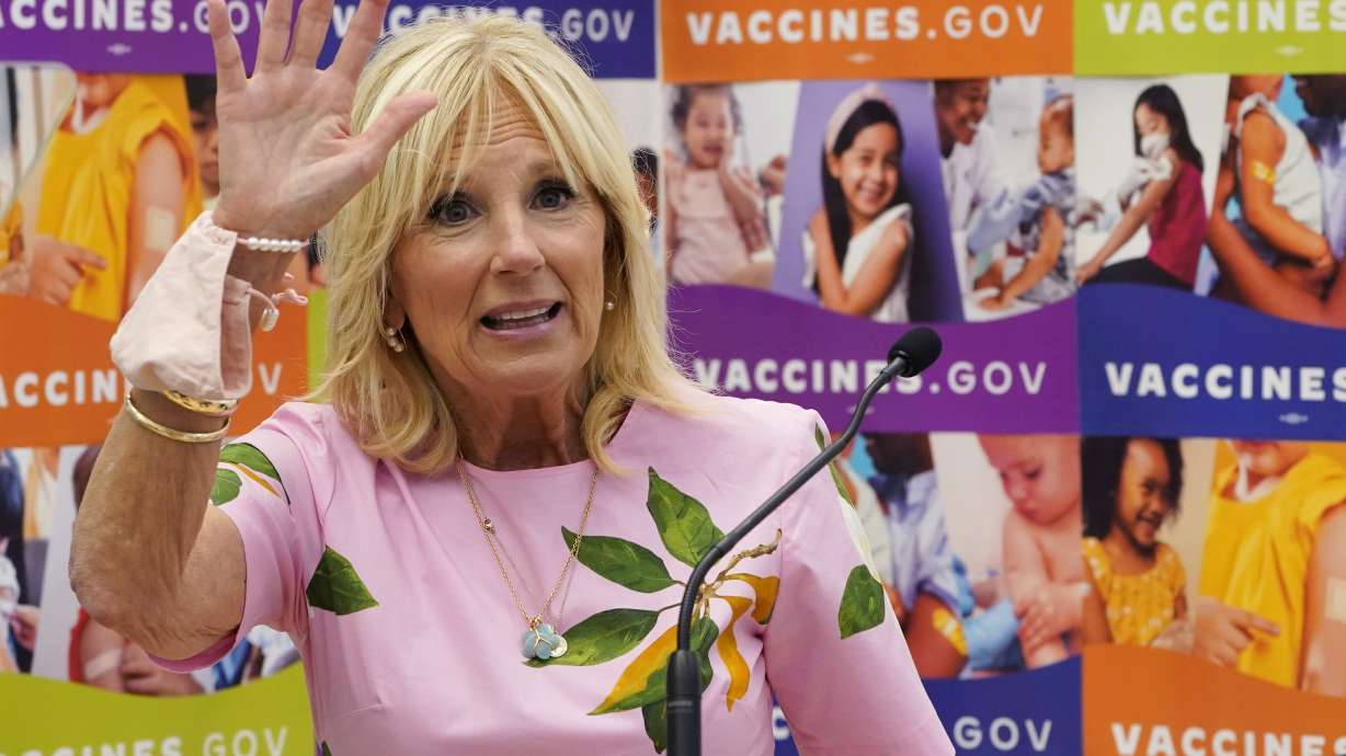 First lady Jill Biden waves as she speaks during a tour of a health facility, July 1 in Richmond, Va. She is apologizing for saying Latinos are “as unique” as San Antonio breakfast tacos.