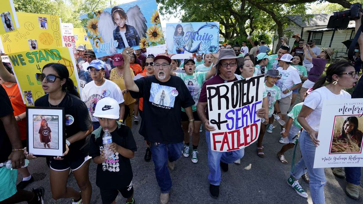 Family and friends of those killed and injured in the school shooting at Robb Elementary take part in a protest march and rally, Sunday, in Uvalde, Texas.