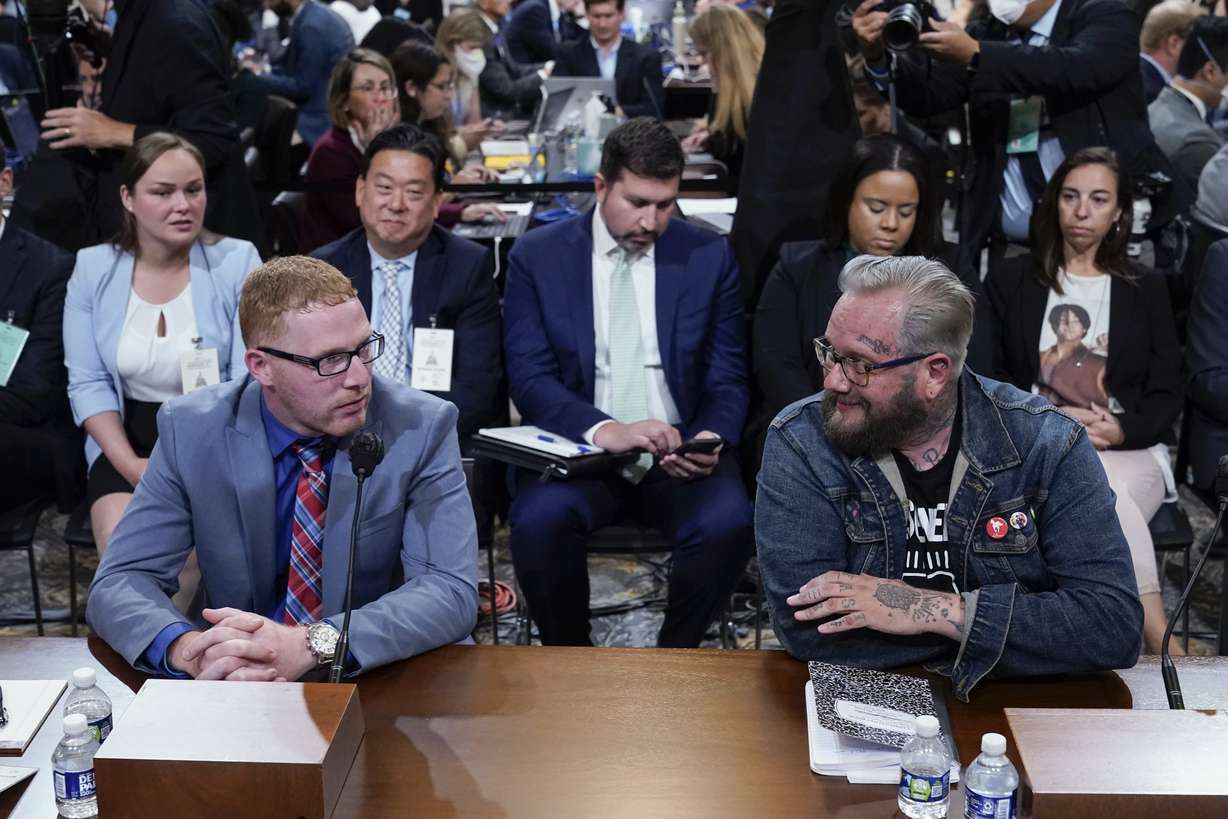 Stephen Ayres, who pleaded guilty last in June to disorderly and disruptive conduct in a restricted building, left, and Jason Van Tatenhove, an ally of Oath Keepers leader Stewart Rhodes, right, arrive to testify as the House select committee investigating the Jan. 6 attack on the U.S. Capitol holds a hearing at the Capitol in Washington, Tuesday.