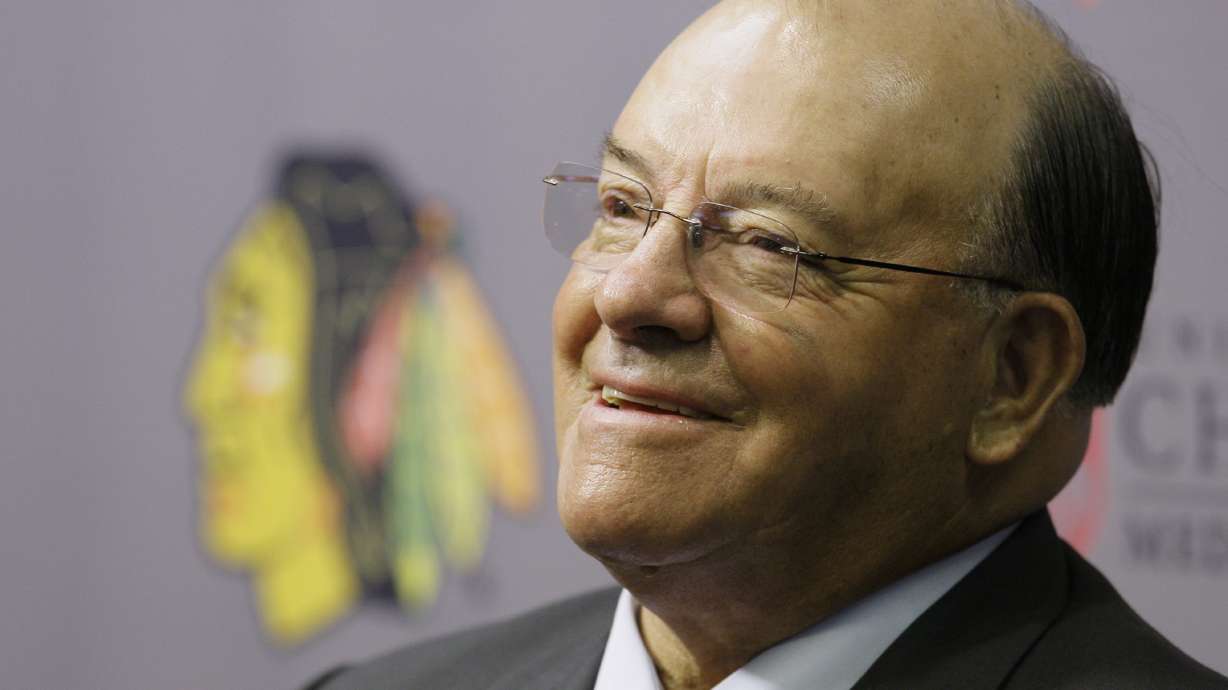 FILE - Eleven-time Stanley Cup champion Scotty Bowman answers questions as he is introduced as the new senior advisor for hockey operations for the Chicago Blackhawks on Thursday, July 31, 2008. Scotty Bowman says he no longer works for the Chicago Blackhawks as of July 1, 2022. The Hockey Hall of Famer who won the Stanley Cup nine times as a coach had been a senior hockey operations adviser since 2008.