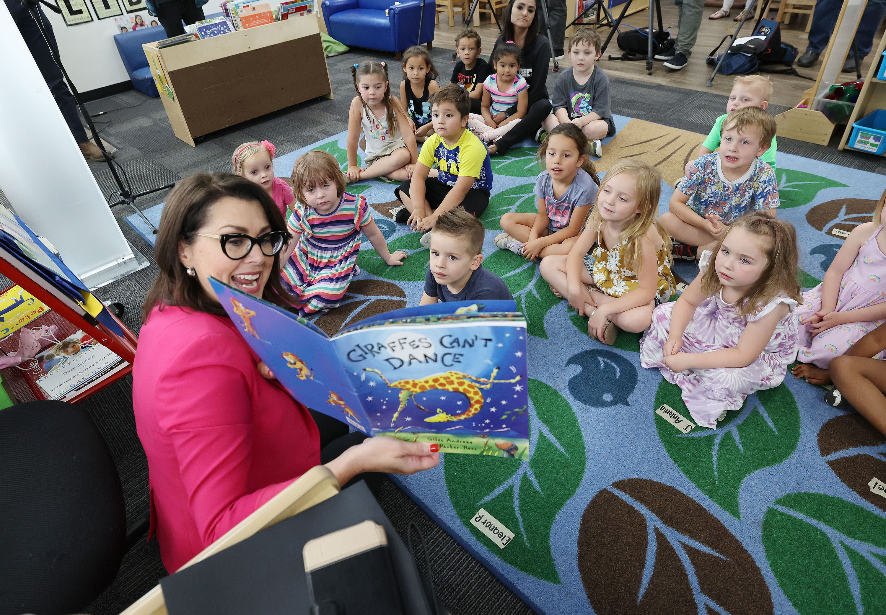 Lt. Gov. Deidre Henderson reads a book to Creative Learning Academy children in Salt Lake City on Tuesday, July 12, 2022. Henderson announced a bonus to youth and early care workforce offered through the Office of Child Care.