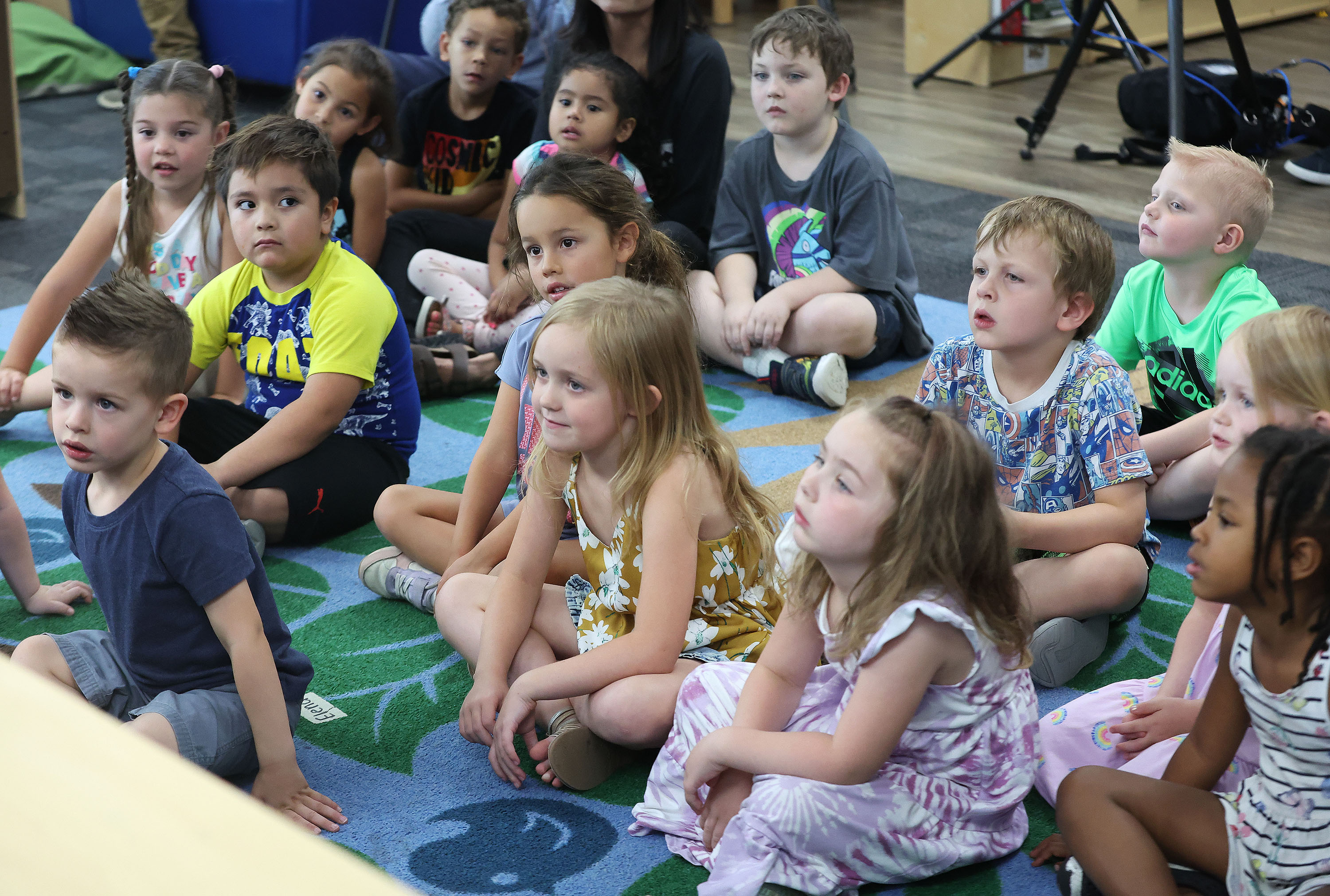 Creative Learning Academy children listen as Lt. Gov. Deidre Henderson reads a book to them in Salt Lake City. Data released by the U.S. Census Bureau in September revealed new findings in local and federal poverty levels and uninsured rates of children.