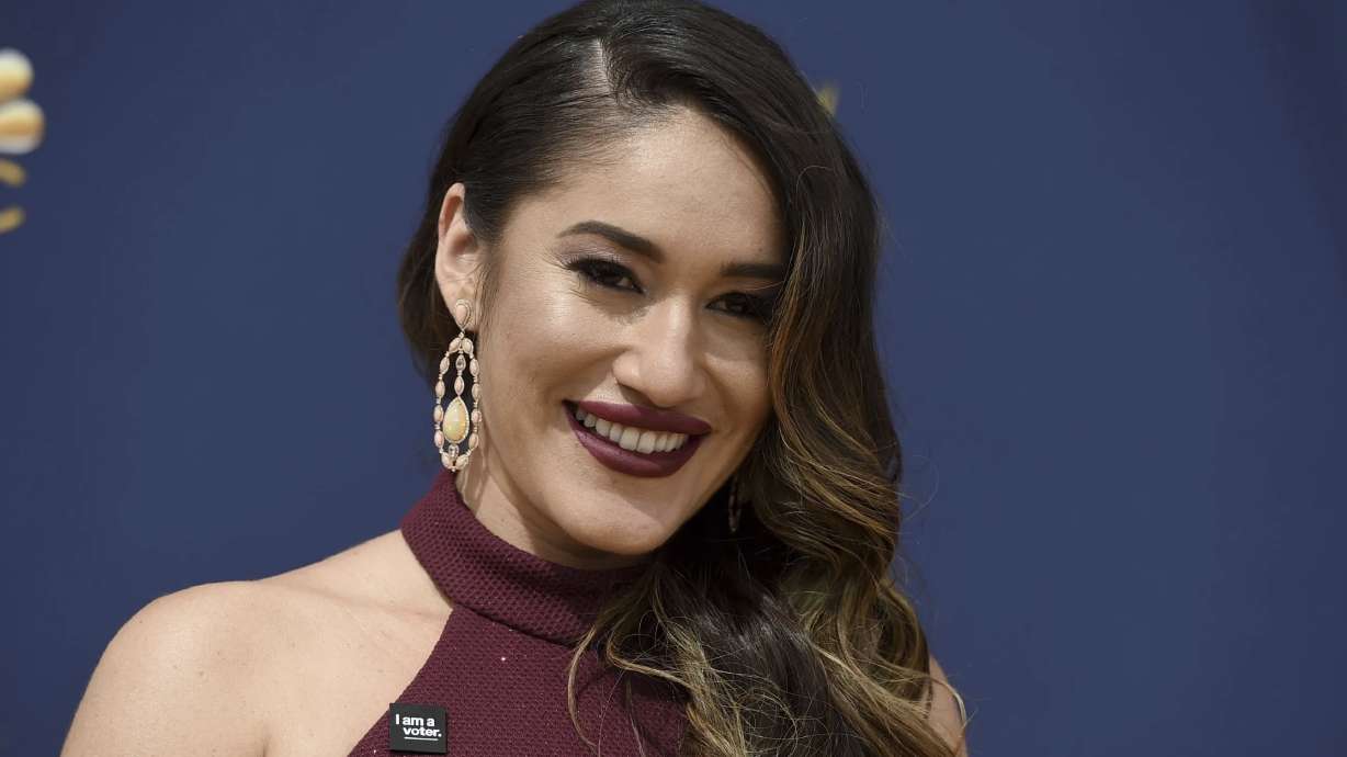Q’orianka Kilcher arrives at the 70th Primetime Emmy Awards on Sept. 17, 2018, in Los Angeles. “Yellowstone” actor Kilcher has been charged with illegally collecting nearly $97,000 in disability benefits while working on the TV show, authorities announced on Monday.