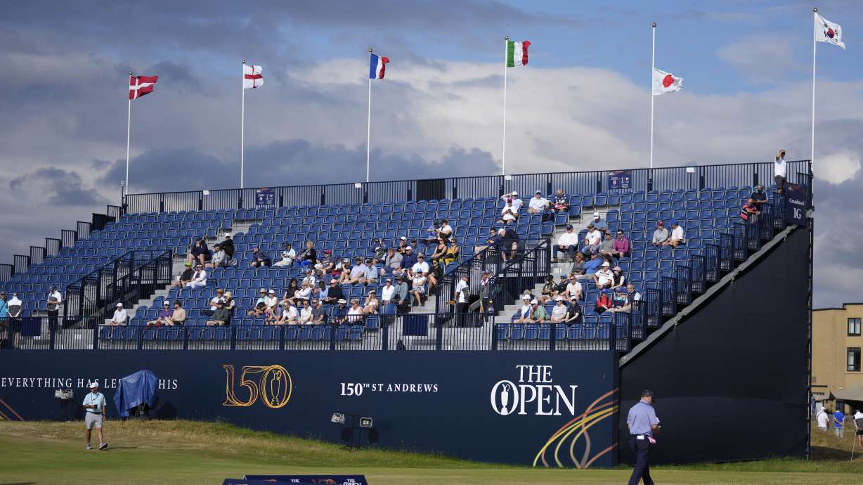 The Japanese flag flies at half staff on the grandstand on the 1st green to commemorate the death of former Japanese Prime Minister Shinzo Abe at the British Open golf championship on the Old Course at St. Andrews, Scotland, Tuesday July 12, 2022.