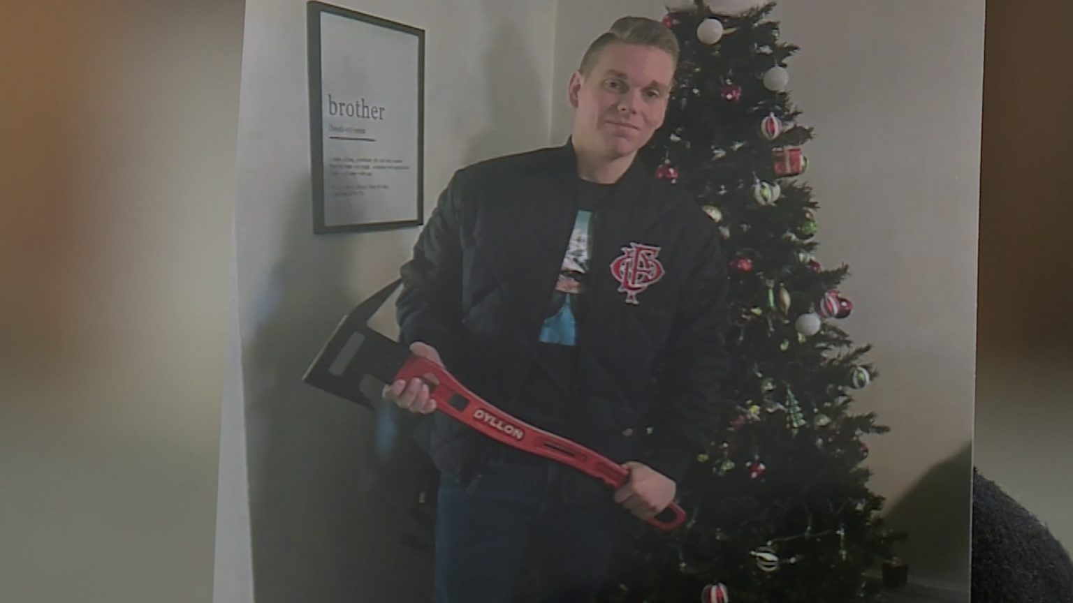 Ogden firefighter Dyllon Ryser receives gifts at a Christmas event.