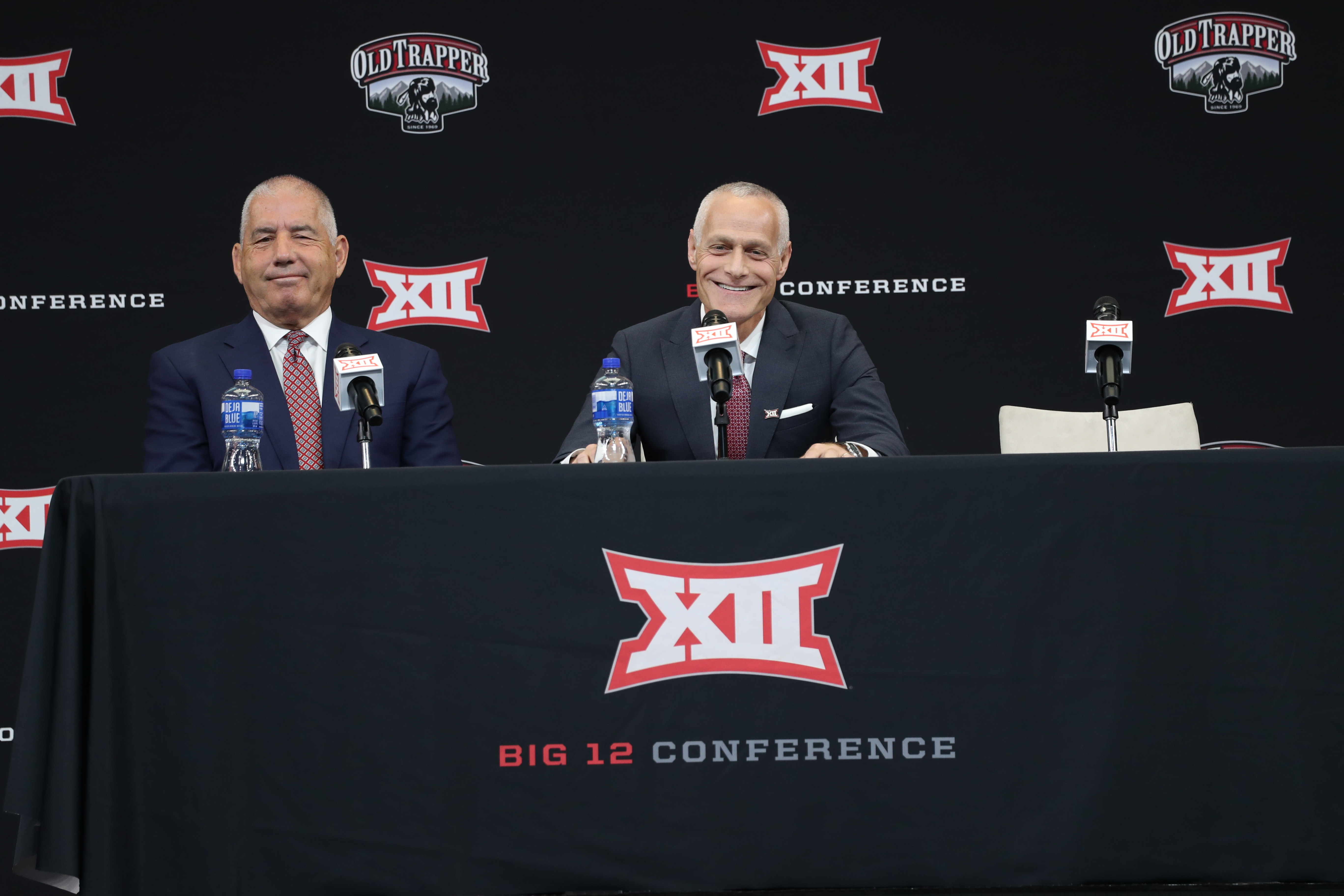 Big 12 outgoing commissioner Bob Bowlsby and incoming commissioner Brett Yormak share a laugh during Big 12 football media days, Wednesday, July 13, 2022 at AT&T Stadium in Arlington, Texas.