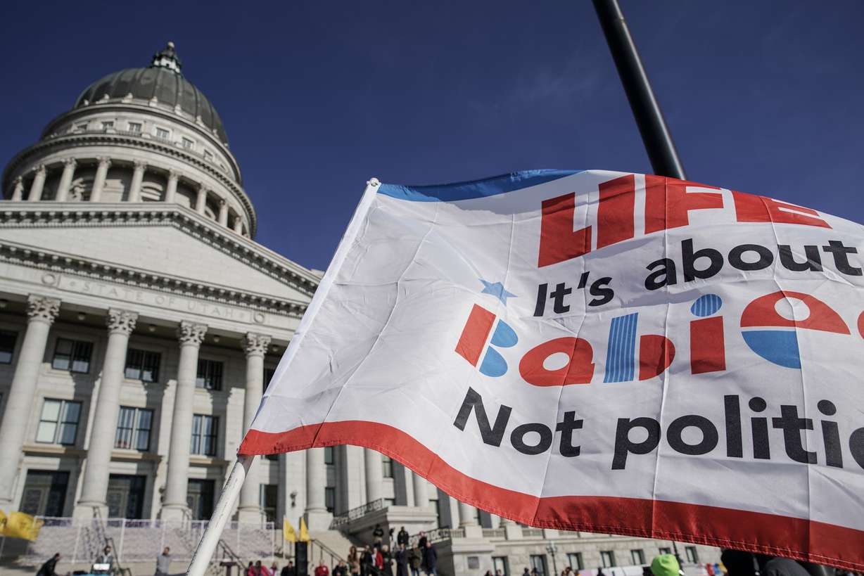 An anti-abortion flag is pictured during the annual March for Life in Salt Lake City on Jan. 22. Drs. Cara Heuser and Alexandra Eller say the way Utah's abortion trigger ban law is written leaves them in an impossible situation.