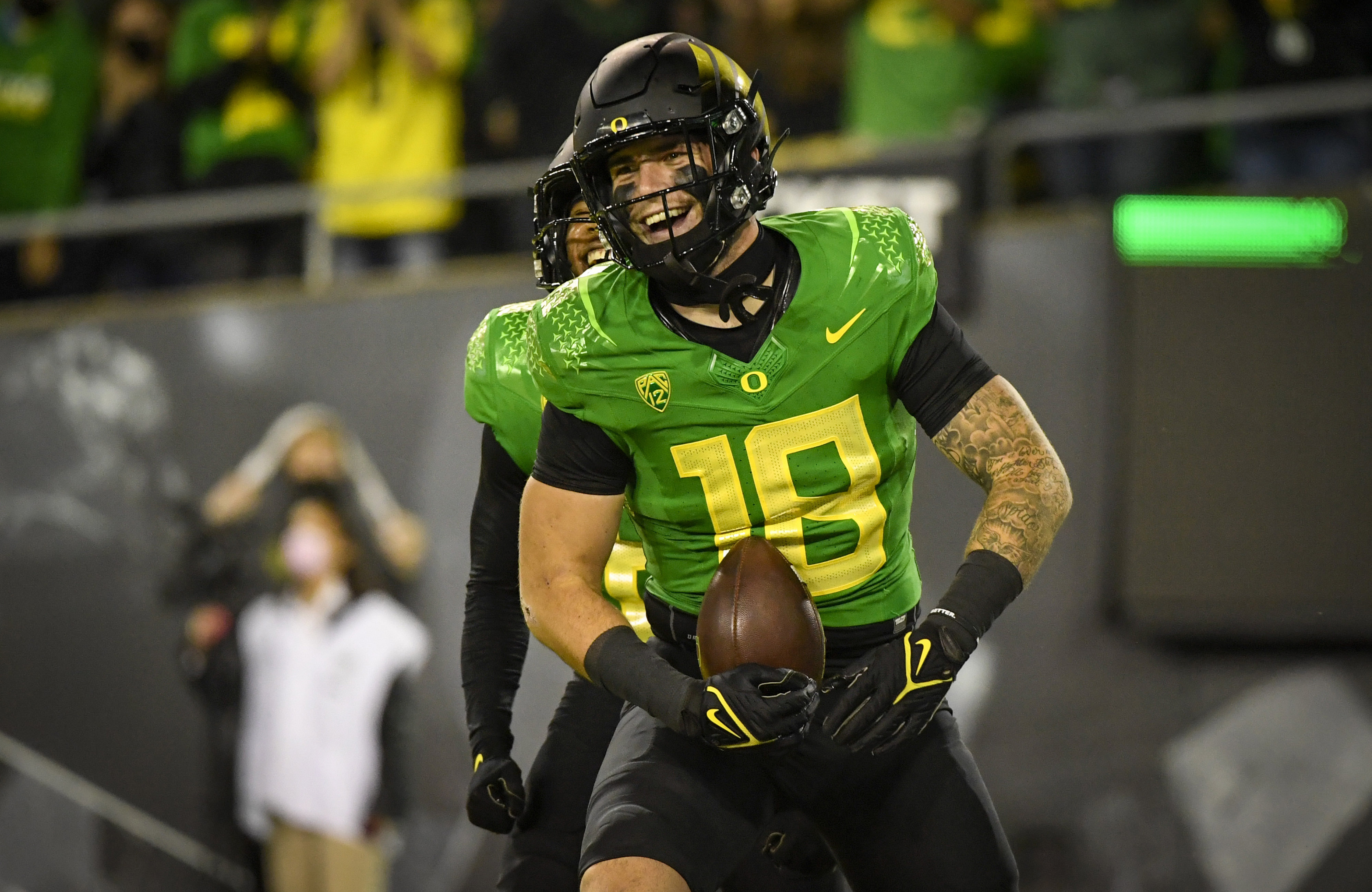 FILE - Oregon Ducks tight end Spencer Webb (18) is shown after a touchdown during an NCAA college football game against Arizona on Sept. 25, 2021, in Eugene, Ore. Webb has died after falling and striking his head on rock slides at a popular swimming lake near Eugene, Oregon. Authorities say the 22-year-old was unresponsive when they arrived at Triangle Lake on Wednesday, July 13, 2022, and found him about 100 yards down a steep trail. 