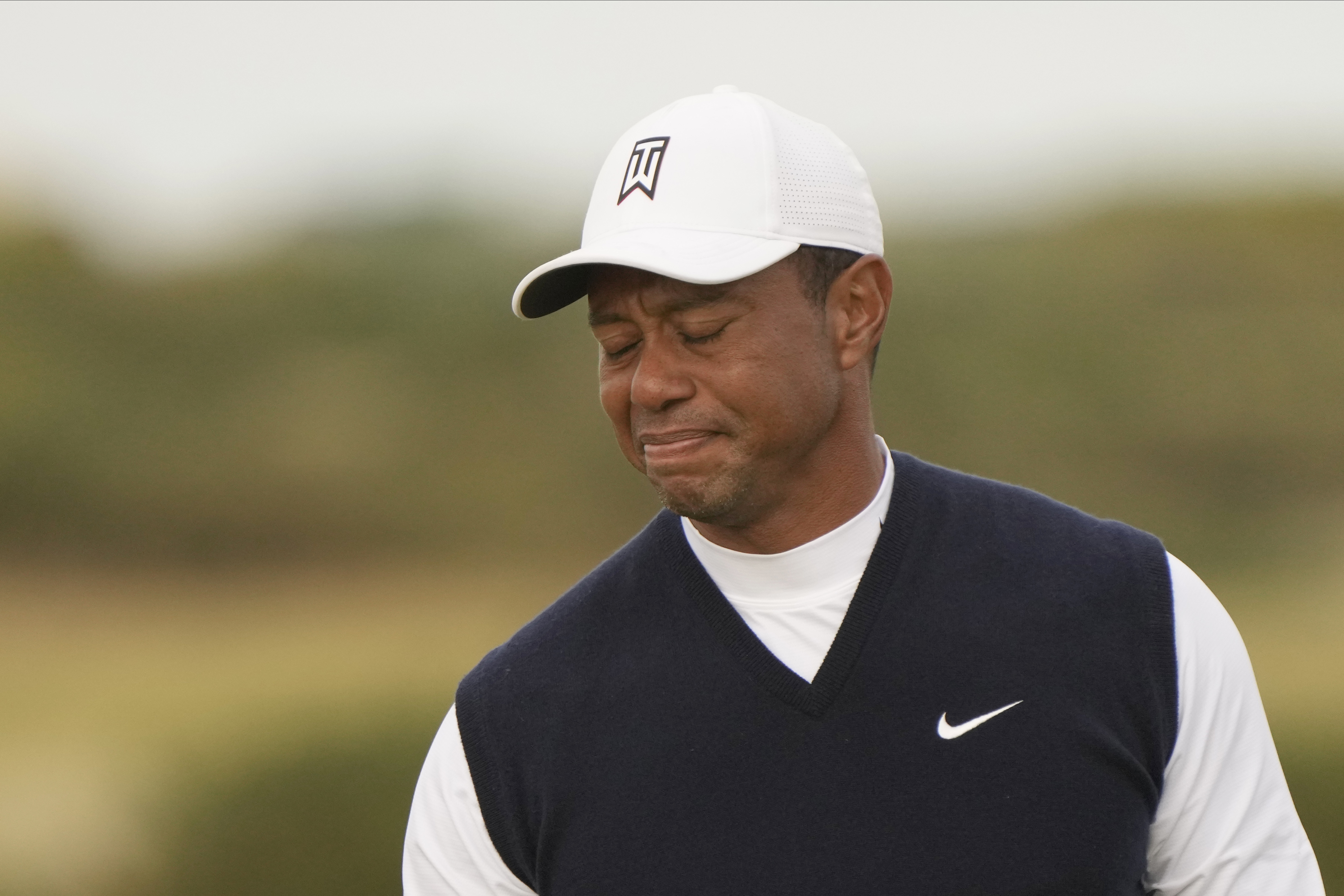 Tiger Woods of the US after putting on the 11th green during the first round of the British Open golf championship on the Old Course at St. Andrews, Scotland, Thursday July 14, 2022. The Open Championship returns to the home of golf on July 14-17, 2022, to celebrate the 150th edition of the sport's oldest championship, which dates to 1860 and was first played at St. Andrews in 1873. 