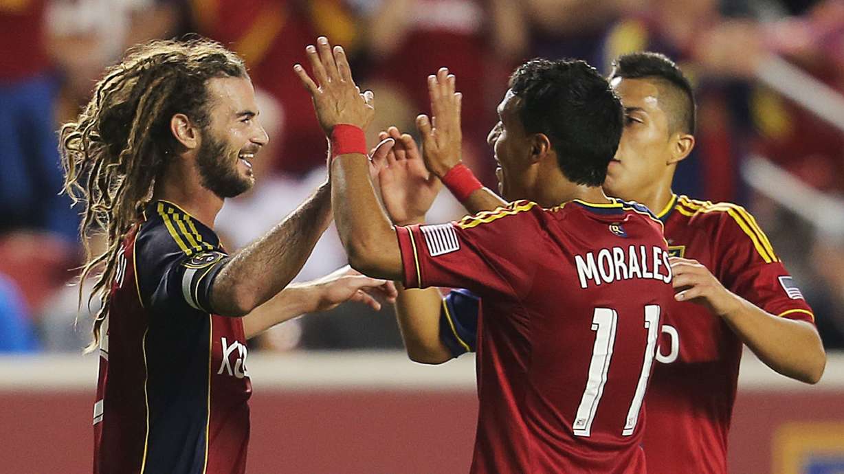 RSL's Kyle Beckerman celebrates a score with teammates Javier Morales and Carlos Salcedo as Real Salt Lake and the Columbus Crew play Saturday, Aug. 24, 2013 at Rio Tinto Stadium.