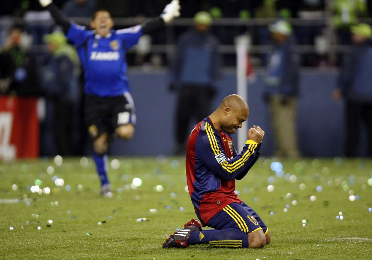 Real's Robbie Russell kneels after making the winning goal as keeper Nick Rimando runs to congratulate him as the Real Salt Lake defeats the Los Angeles Galaxy in a shootout soccer to win the MLS Cup final at Qwest Field Sunday, Nov. 22, 2009,in Seattle, Washington.