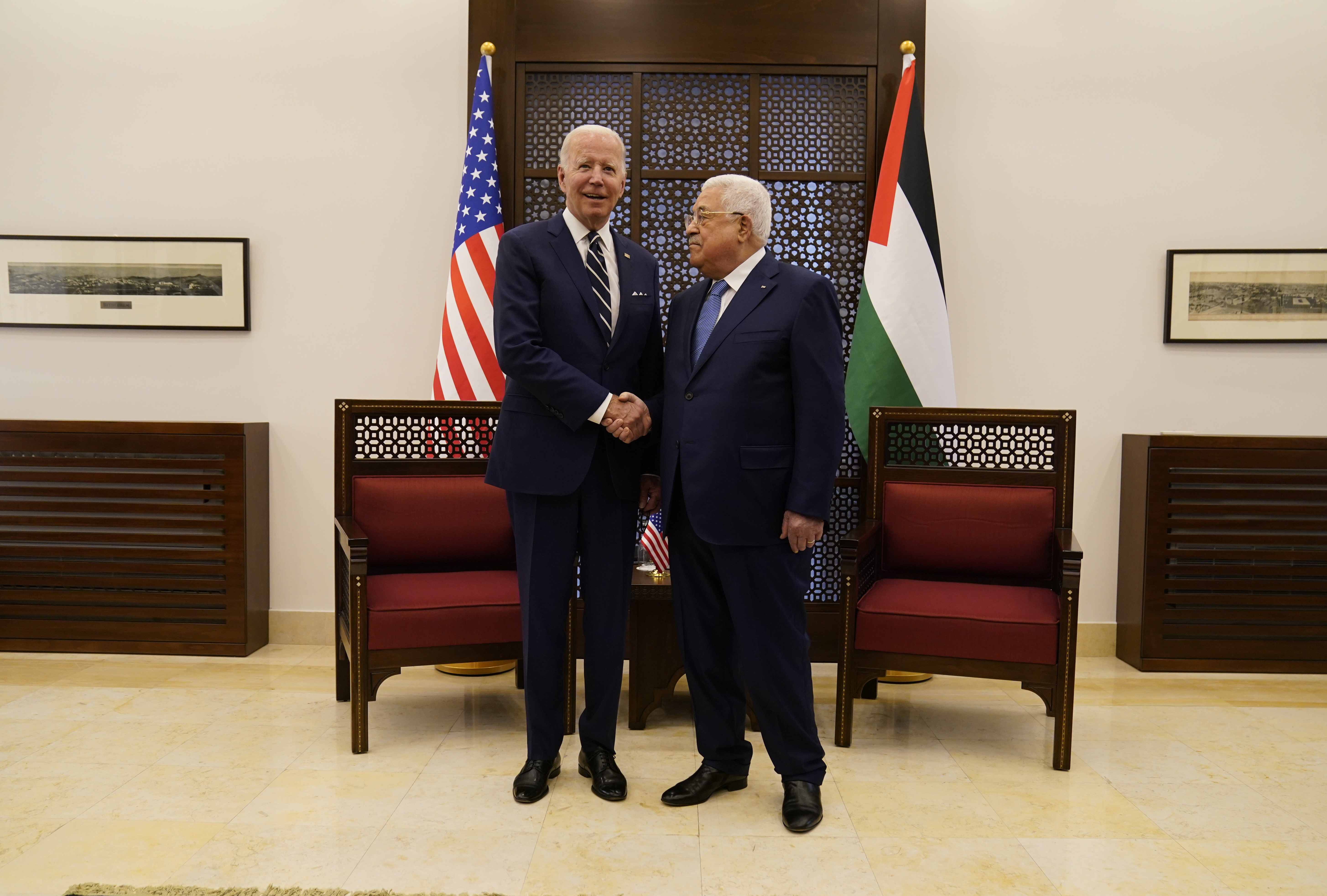 Palestinian President Mahmoud Abbas and U.S. President Joe Biden shake hands in the West Bank town of Bethlehem, Friday.