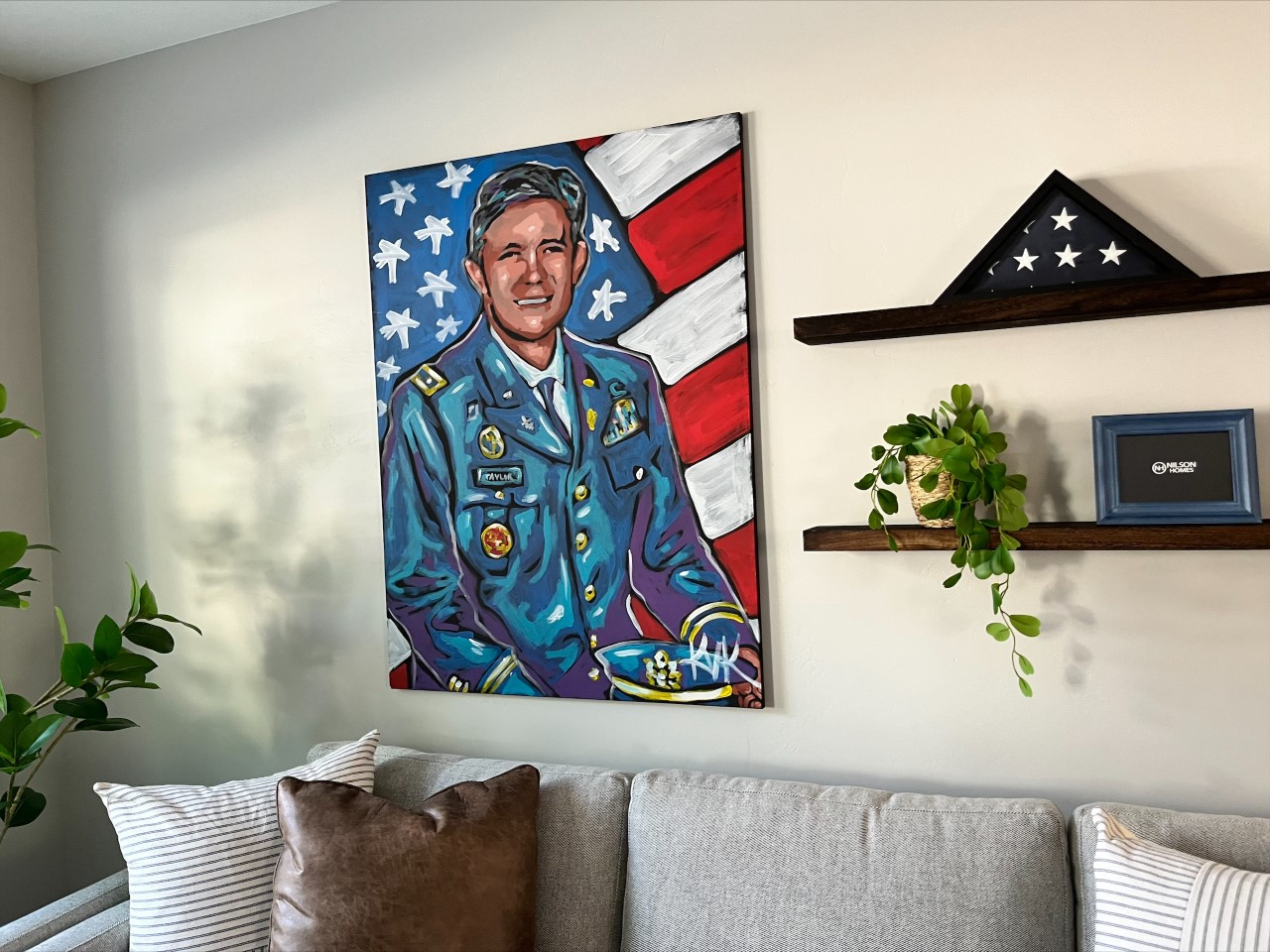 A painting of Brent Taylor hangs on the wall in his family's new home in North Ogden Thursday.