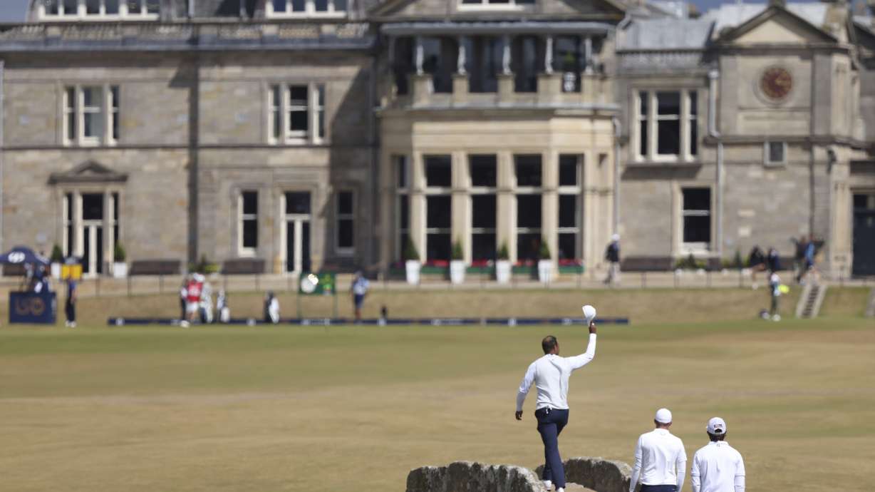 Tiger Woods of the US gestures to the crowd at the end of his second round of the British Open golf championship on the Old Course at St. Andrews, Scotland, Friday July 15, 2022. The Open Championship returns to the home of golf on July 14-17, 2022, to celebrate the 150th edition of the sport's oldest championship, which dates to 1860 and was first played at St. Andrews in 1873.