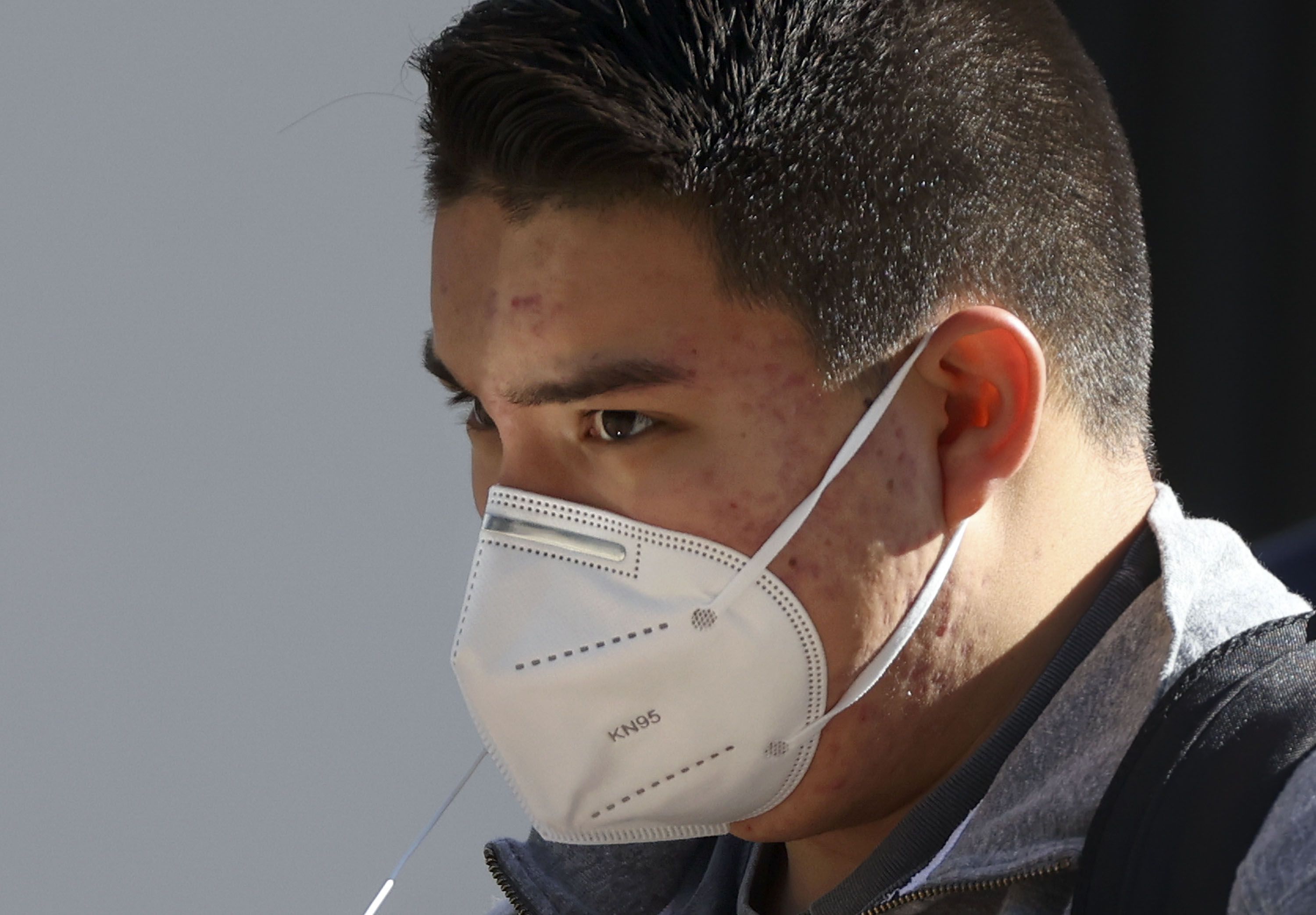 Santiago Cruz wears a KN95 mask in downtown Salt Lake City on Jan. 26. Six of Utah’s 29 counties — Salt Lake, Summit, Wasatch, Tooele, San Juan and Piute — are at the Centers for Disease Control and Prevention’s high community level for COVID-19, where universal masking is recommended as case counts and hospitalizations keep going up.