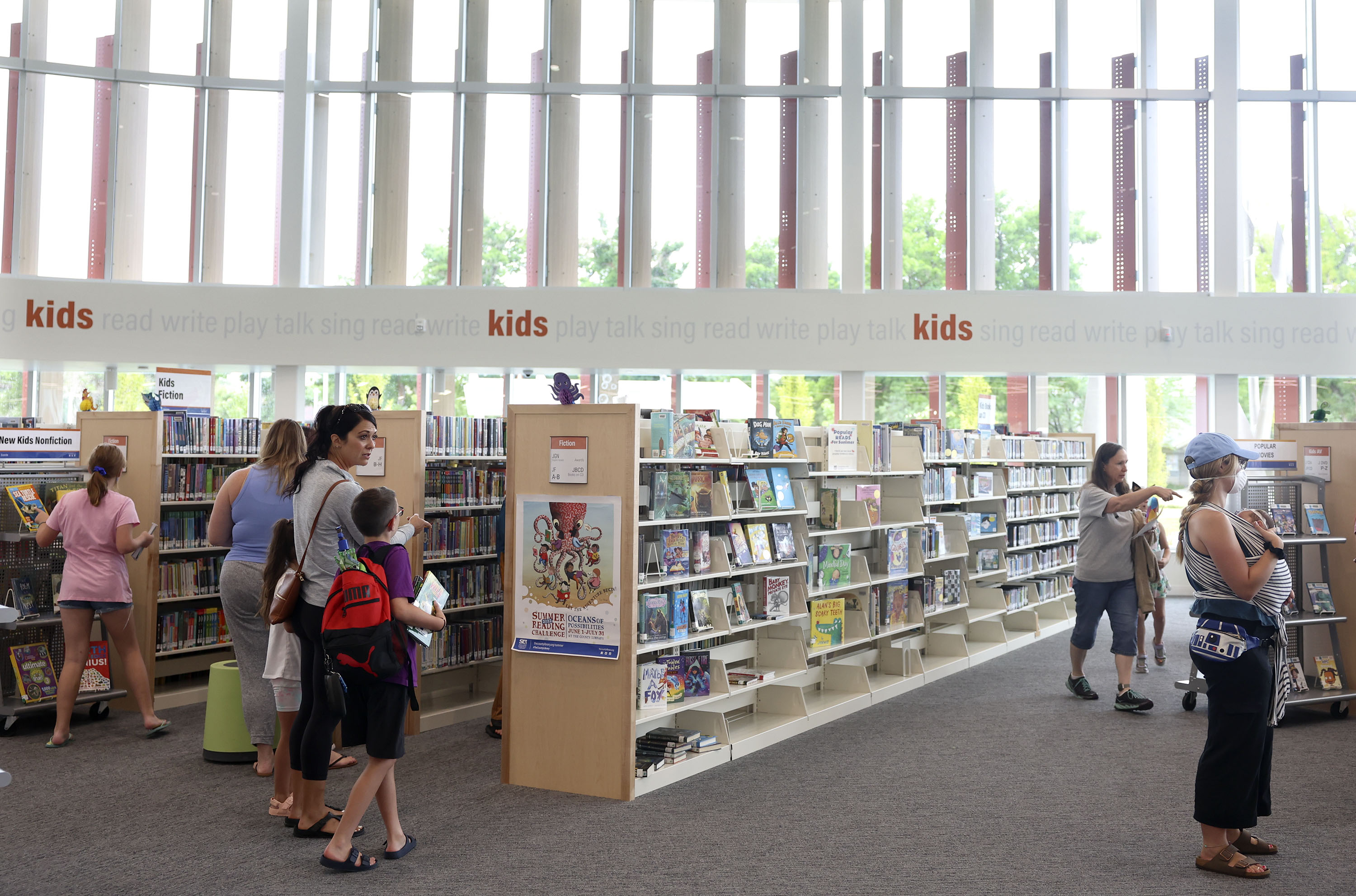 People attend the grand opening of the Salt Lake County Library’s Granite branch in South Salt Lake on Friday.