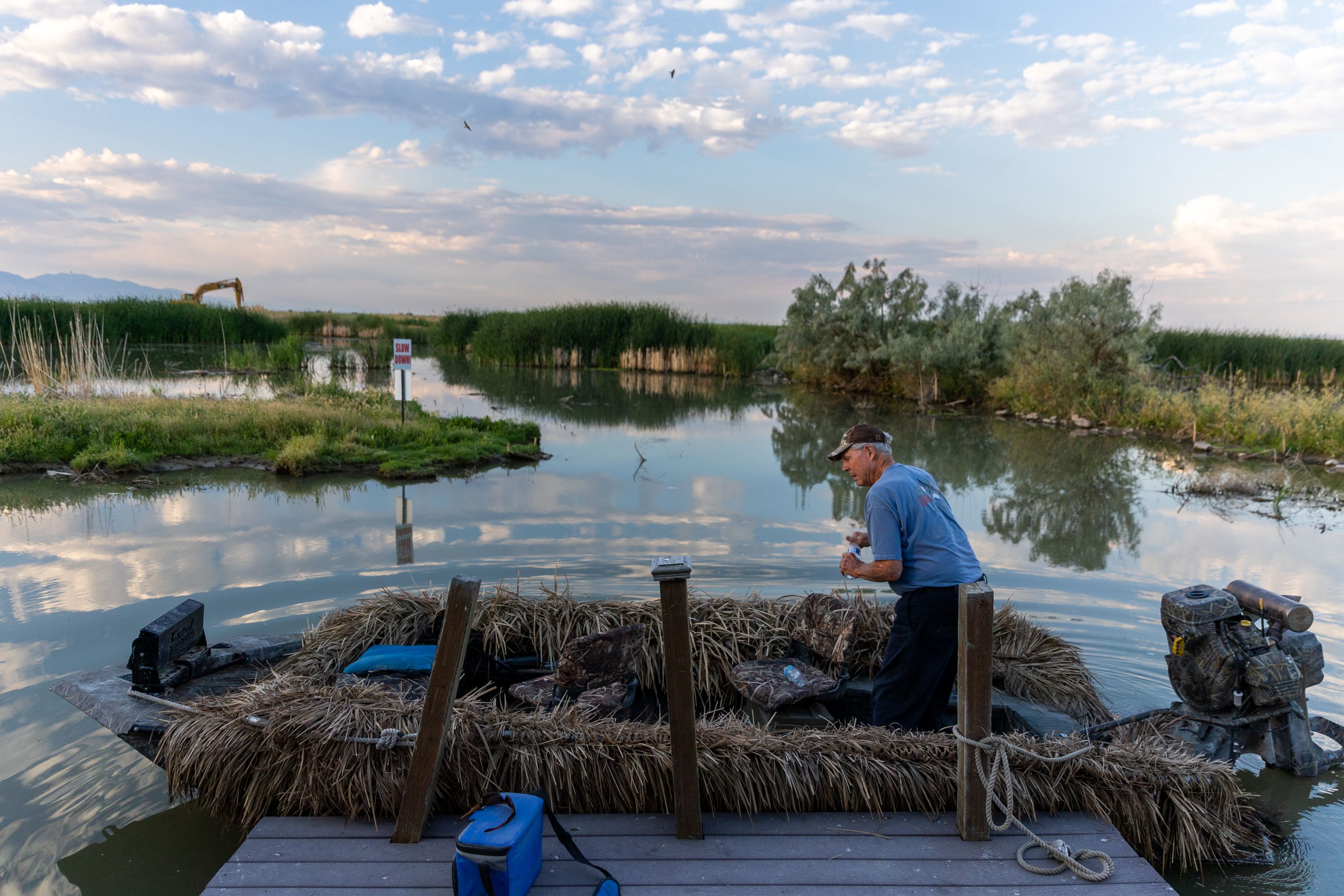 Carroll Dolson, a member of the Chesapeake Duck Club near Corinne, Box Elder County, prepares his boat club on Wednesday.