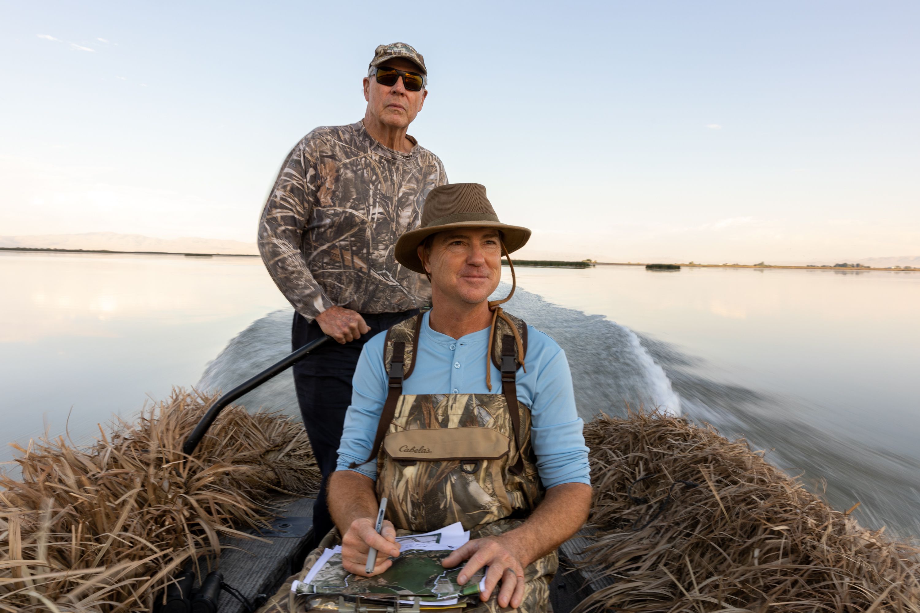 Carroll Dolson, left, a member of the Chesapeake Duck Club near Corinne, Box Elder County, drives Chris Bonsignore, manager of conservation programs at Ducks Unlimited, around the club’s waters so Bonsignore can take notes on Wednesday.