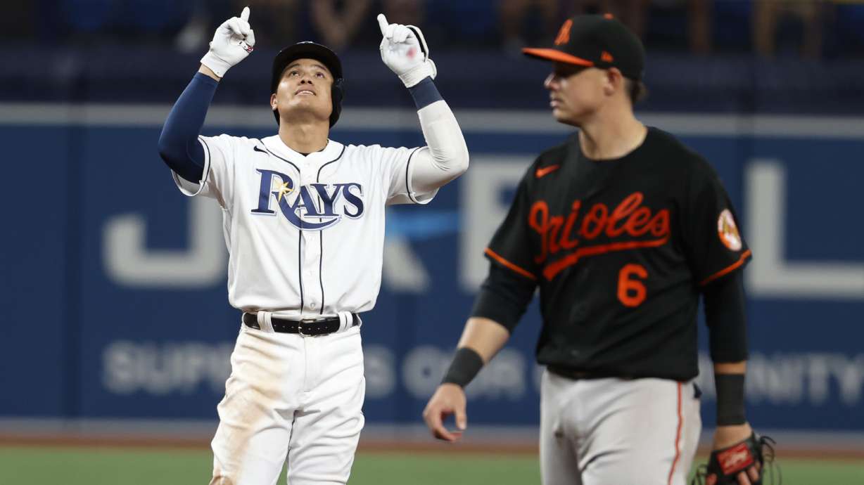 Tampa Bay Rays' Yu Chang gestures after hitting an RBI double against the Baltimore Orioles during the sixth inning of a baseball game Friday, July 15, 2022, in St. Petersburg, Fla.