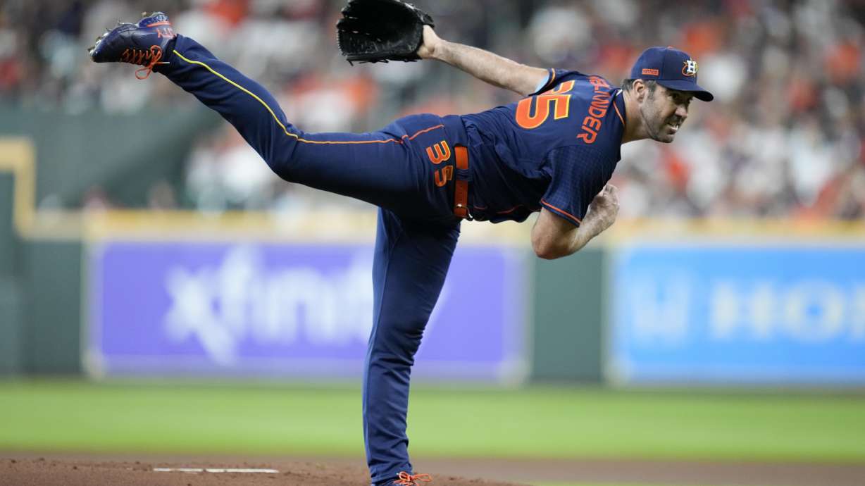 Houston Astros starting pitcher Justin Verlander follows through on a pitch during the first inning of a baseball game against the Oakland Athletics, Saturday, July 16, 2022, in Houston.