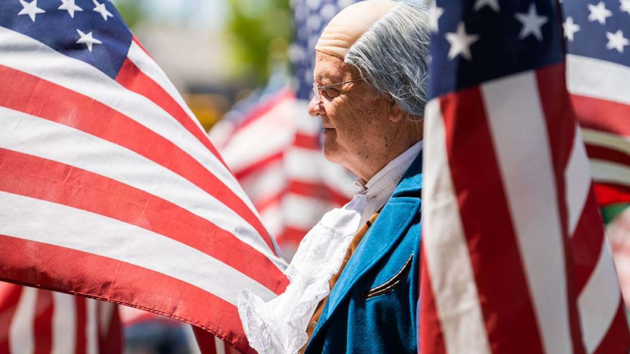 Gregory C. Duerden, of the Independent American Party and who is dressed as Benjamin Franklin for the “Cries of Freedom” event, stands outside of the SECRA Center of the Arts in Orem on July 4. The Independent American Party of Utah has seen steady growth over the last few years as more voters have registered with the conservative party.
