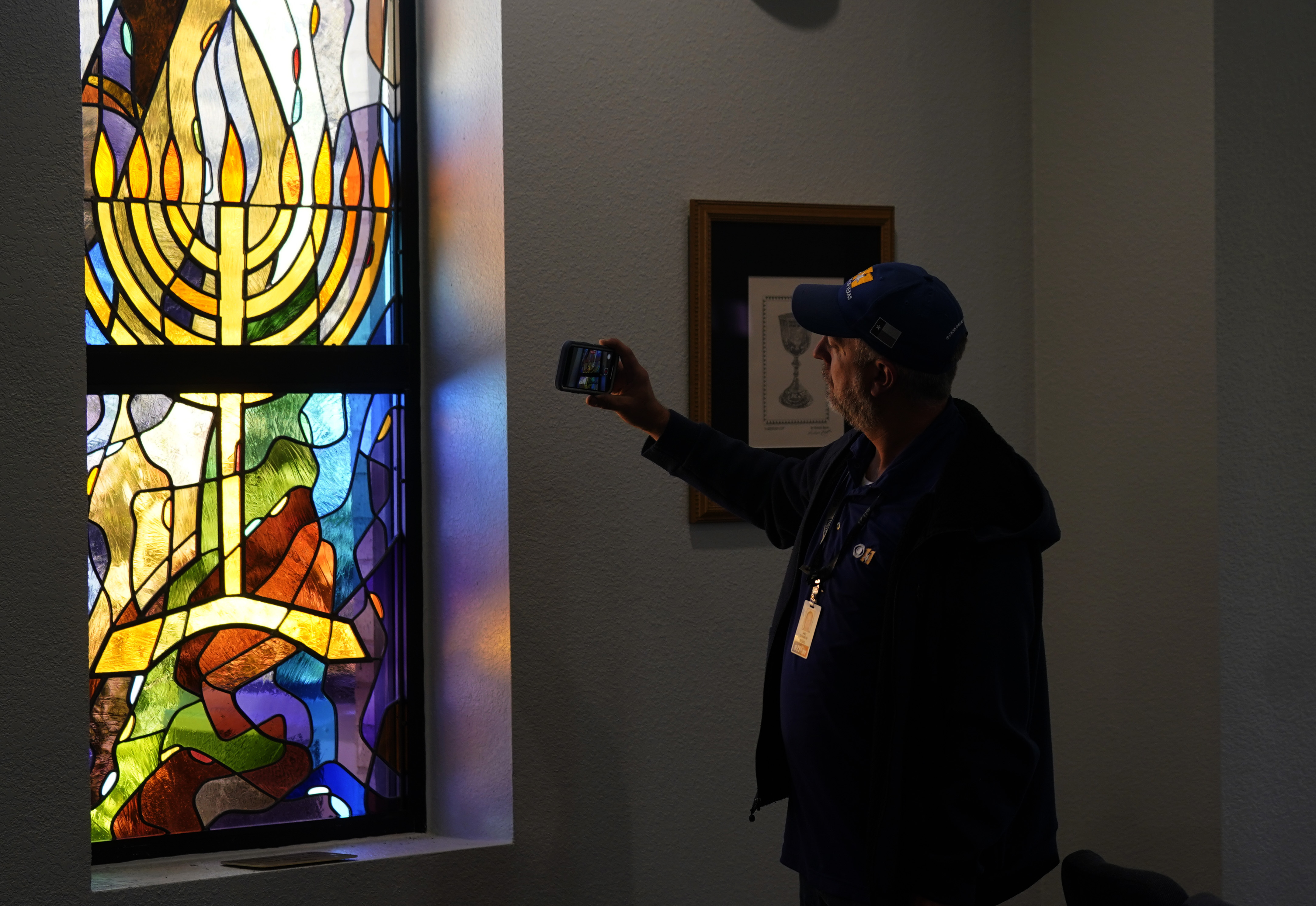 A stained glass window that once had bullet holes is now repaired at Congregation Beth Israel in Colleyville, Texas, on April 7. In January, four were taken hostage by a pistol-wielding man during a Shabbat service.