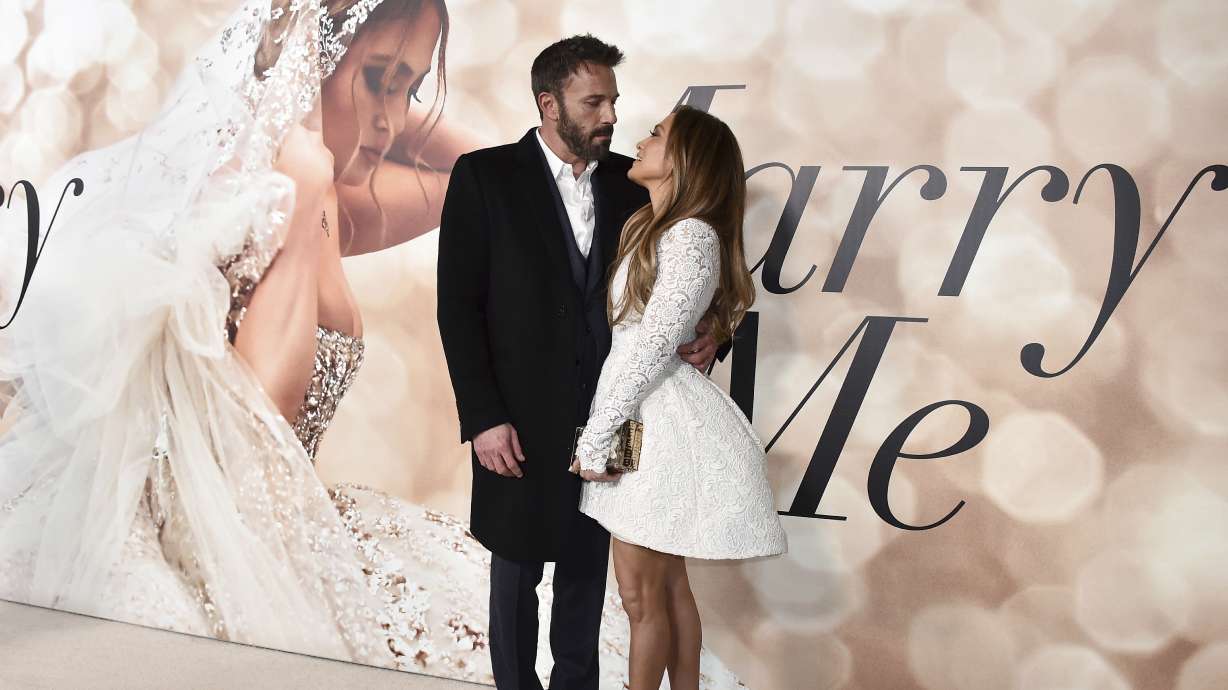 Cast member Jennifer Lopez, right, and Ben Affleck, left, attend a photo call for a special screening of "Marry Me" at DGA Theater on Feb. 8, in Los Angeles. The couple have obtained a marriage license in Nevada, according to court records posted July 17.