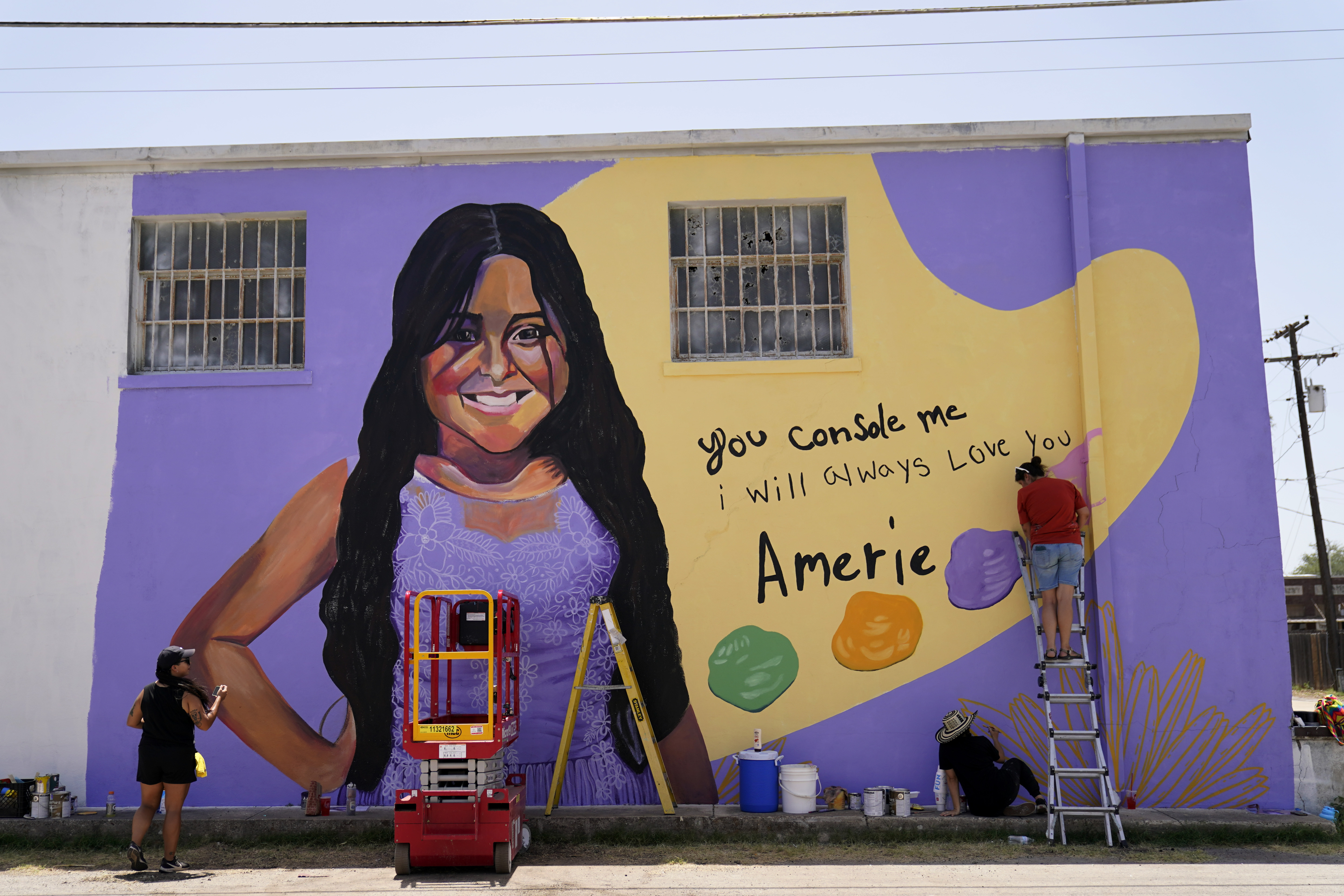 Artists work on a mural to honor Amerie Jo Garza, a student who was killed in the shootings at Robb Elementary school last month, Sunday, in Uvalde, Texas. The Texas House investigative committee released its full report on the shootings at Robb Elementary School Sunday.