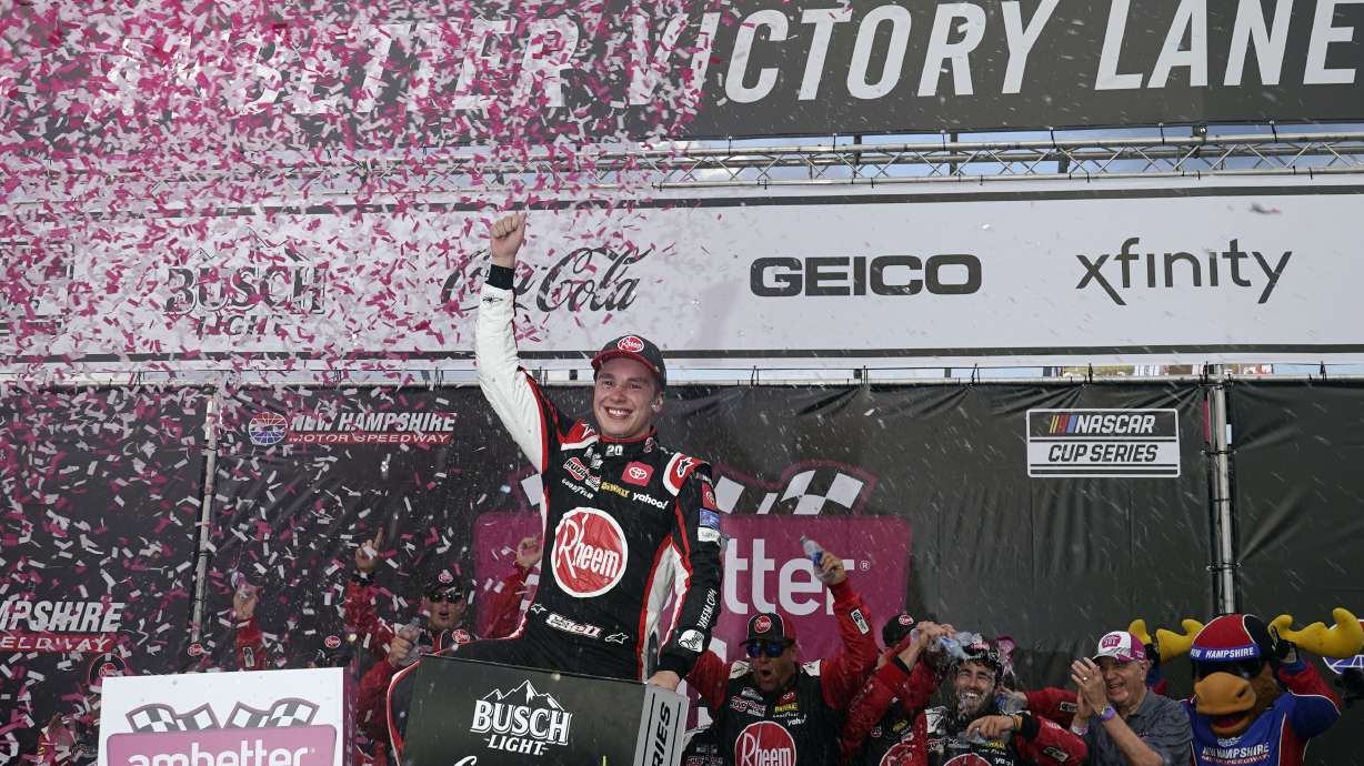 Christopher Bell celebrates after winning a NASCAR Cup Series auto race at the New Hampshire Motor Speedway, Sunday, July 17, 2022, in Loudon, N.H.