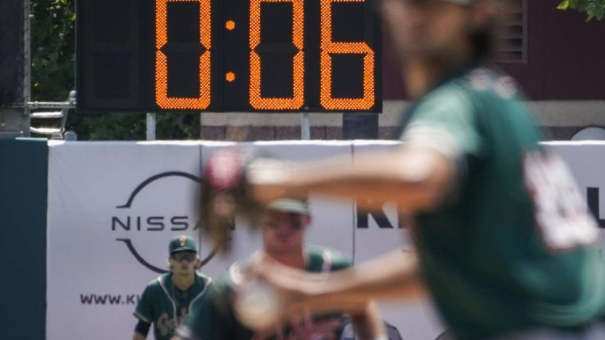 A pitch clock is deployed to restrict pitcher preparation times during a minor league baseball game between the Brooklyn Cyclones and Greensboro Grasshoppers, Wednesday, July 13, 2022, in the Coney Island neighborhood of the Brooklyn borough of New York. Major League Baseball is considering a pitch clock for next year along with shift limits, larger bases and restrictions on pickoff attempts.