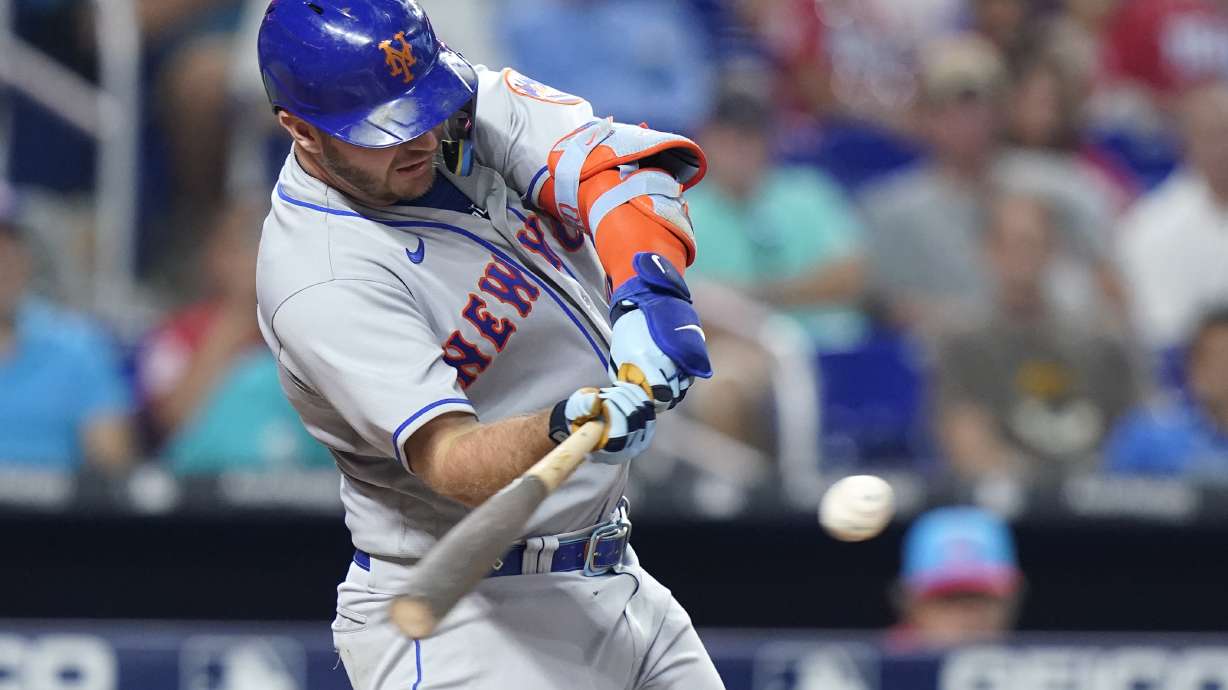 New York Mets' Pete Alonso hits a solo home run during the eighth inning of a baseball game against the Miami Marlins, Saturday, June 25, 2022, in Miami. The Mets won 5-3.