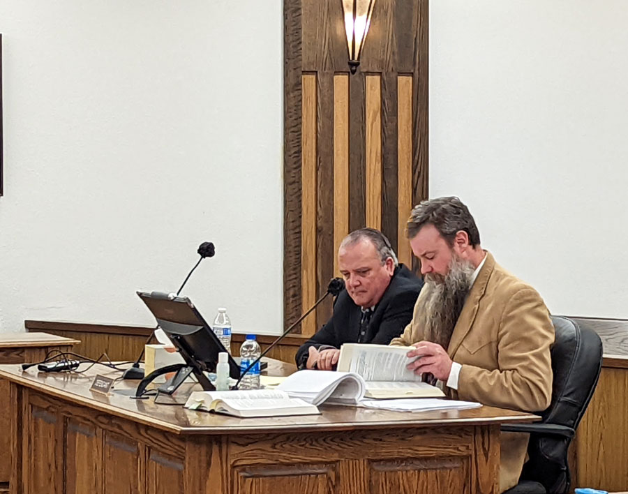Sheriff Craig Rowland sits with his defense attorney Justin Olesen at a March 2 preliminary hearing. A trial set to begin next week for the Bingham County Sheriff has been vacated after the defense attorney’s request for withdrawal from the case was approved.
