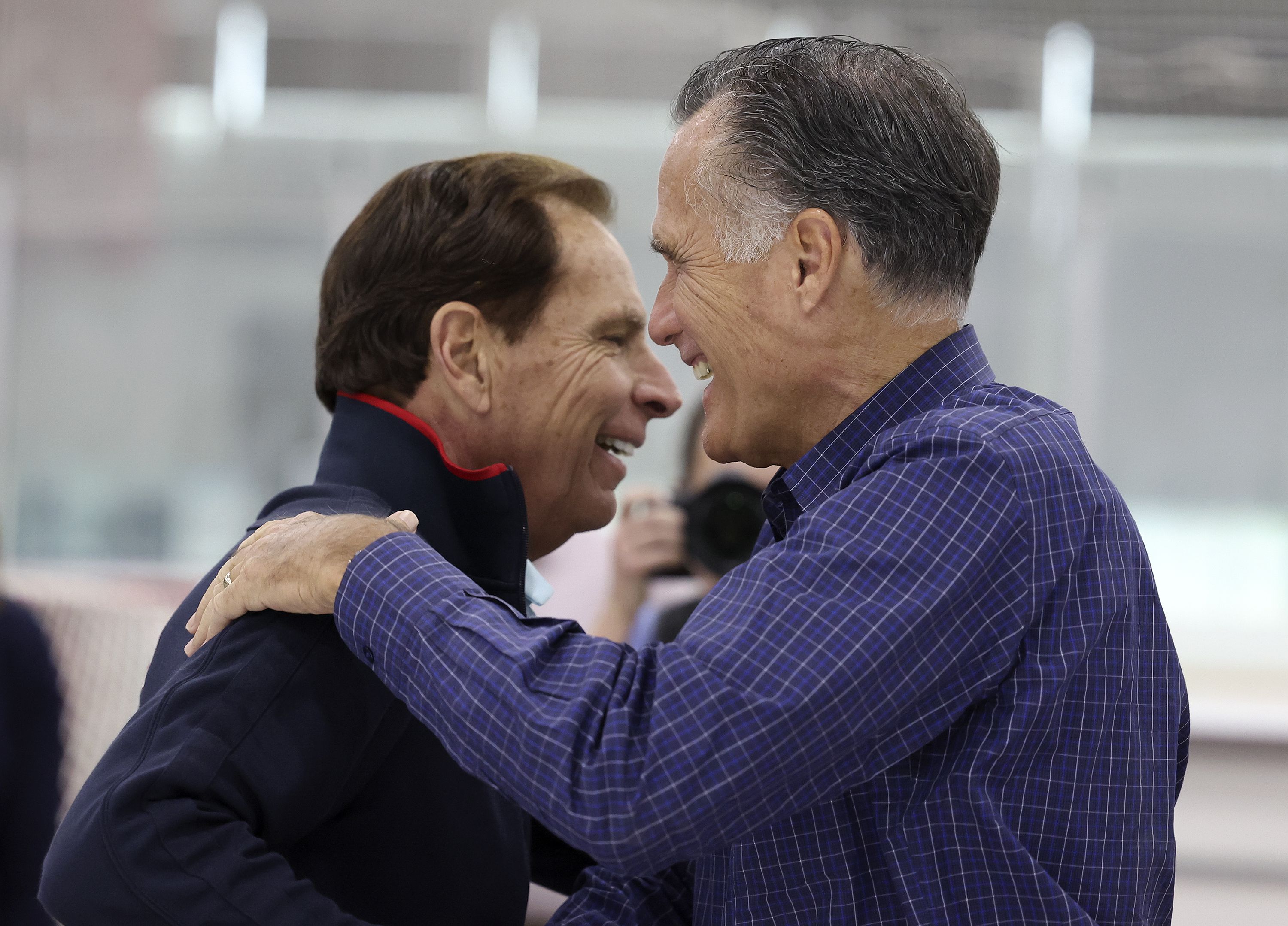 Fraser Bullock, president and CEO of the Salt Lake City-Utah Committee for the Games, left, and Sen. Mitt Romney, R-Utah, greet one another at the Utah Olympic Oval in Kearns on Friday, May 27.