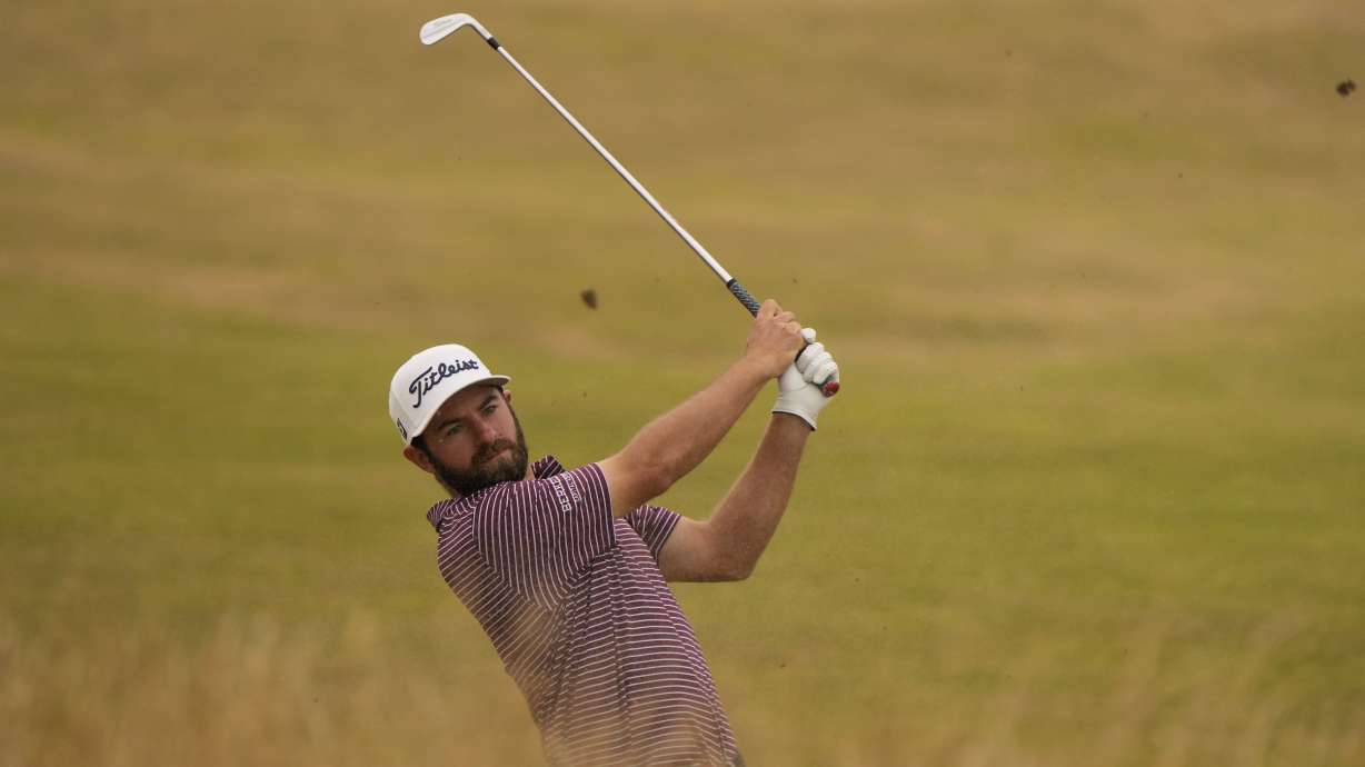 Cameron Young of the US plays out of the rough on the 13th fairway during the final round of the British Open golf championship on the Old Course at St. Andrews, Scotland, Sunday July 17, 2022.