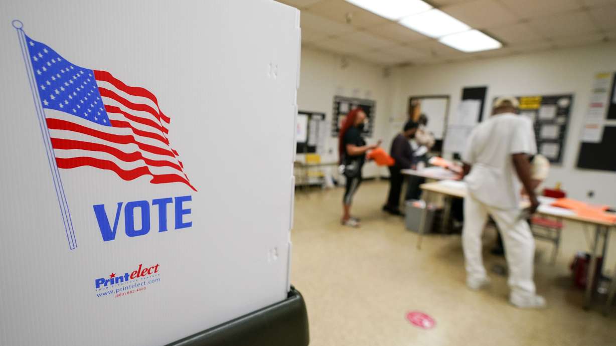 People check in to vote at Edmondson Westside High School during Maryland’s primary election on Tuesday, in Baltimore.