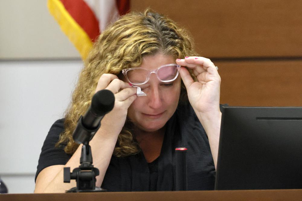 Marjory Stoneman Douglas High School teacher Dara Hass wipes away tears as she testifies in court about the shooting in her classroom during the penalty phase of Marjory Stoneman Douglas High School shooter Nikolas Cruz's trial at the Broward County Courthouse in Fort Lauderdale, Fla., on Tuesday.