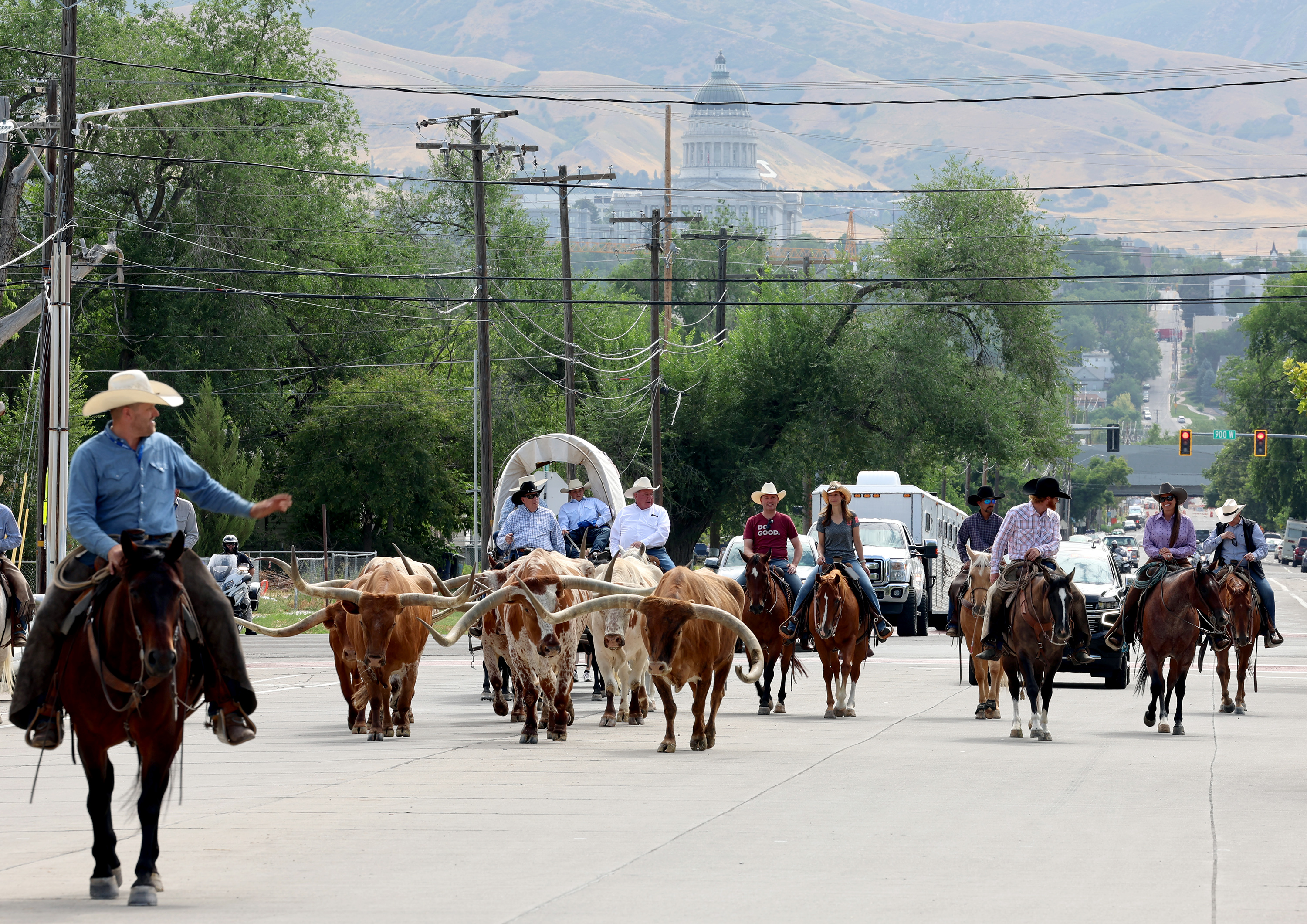 Gov. Spencer Cox and first lady Abby Cox join in on the Days of '47 Cattle Drive that ended at the Utah State Fairpark in Salt Lake City on Tuesday. They also held a press conference encouraging residents to come to the Days of '47 Rodeo and festivities.