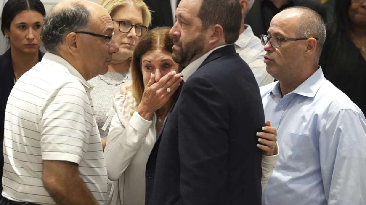 Linda Beigel Schulman, center, mother of Scott Beigel, is comforted by other victims' family during the penalty phase of Marjory Stoneman Douglas High School shooter Nikolas Cruz's trial at the Broward County Courthouse in Fort Lauderdale, Fla., Tuesday. Cruz previously plead guilty to all 17 counts of premeditated murder and 17 counts of attempted murder in the 2018 shootings.
