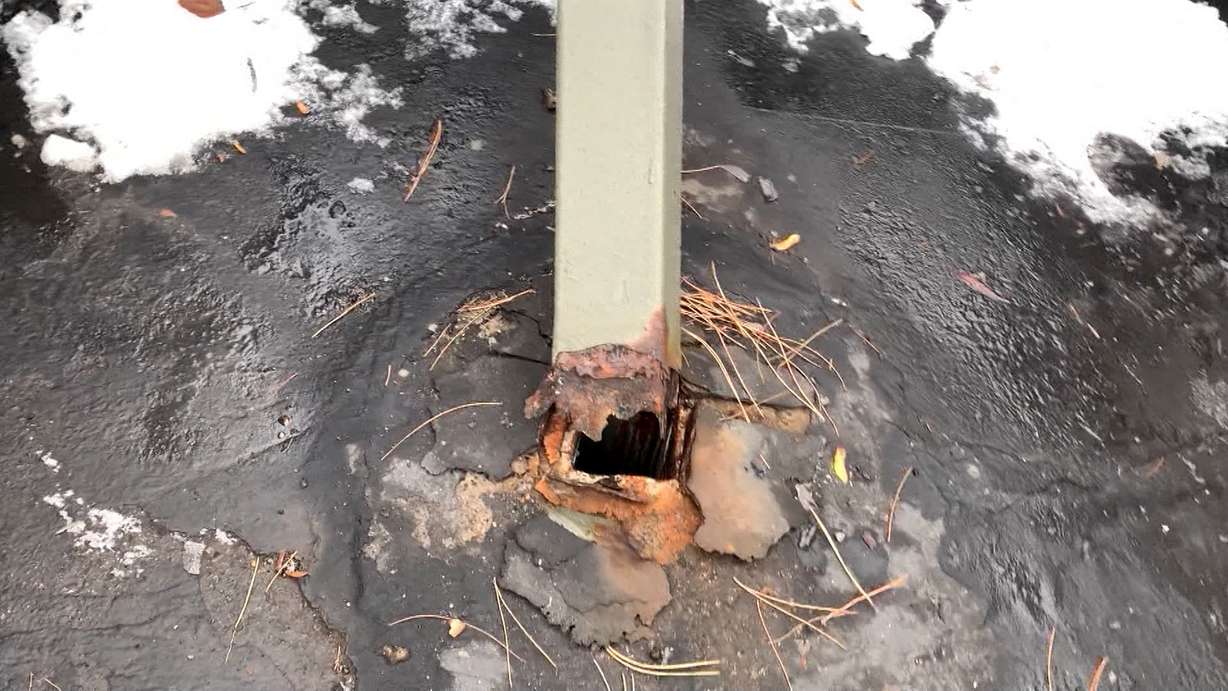 A shot taken by the Shraders appears to show the carport’s support columns were rusted and flaky where their bases met the parking lot asphalt.