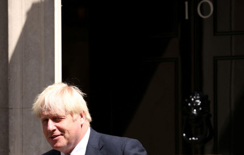 British Prime Minister Boris Johnson walks outside Downing Street in London, Britain, Wednesday.